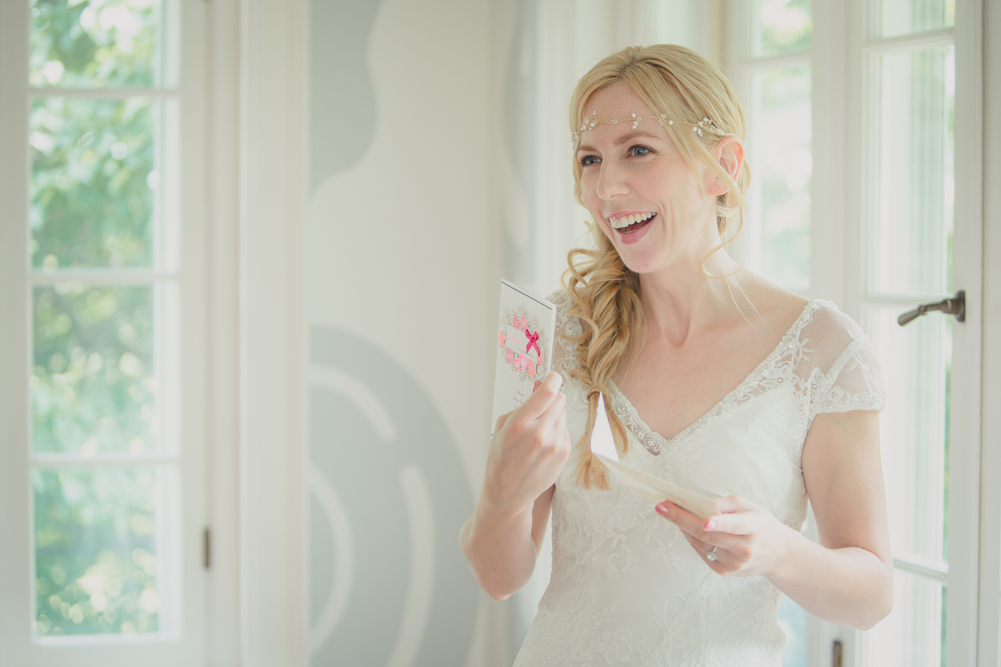 bride reads card from groom in secret room at small wedding at Knox Farm near Buffalo, NY