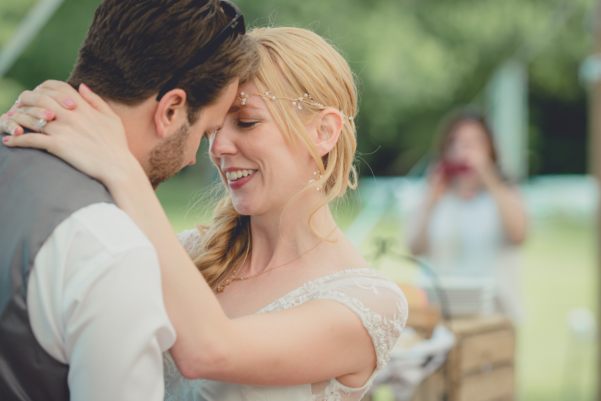 bride and groom share first dance under tent at reception at small wedding at Knox Farm near Buffalo, NY