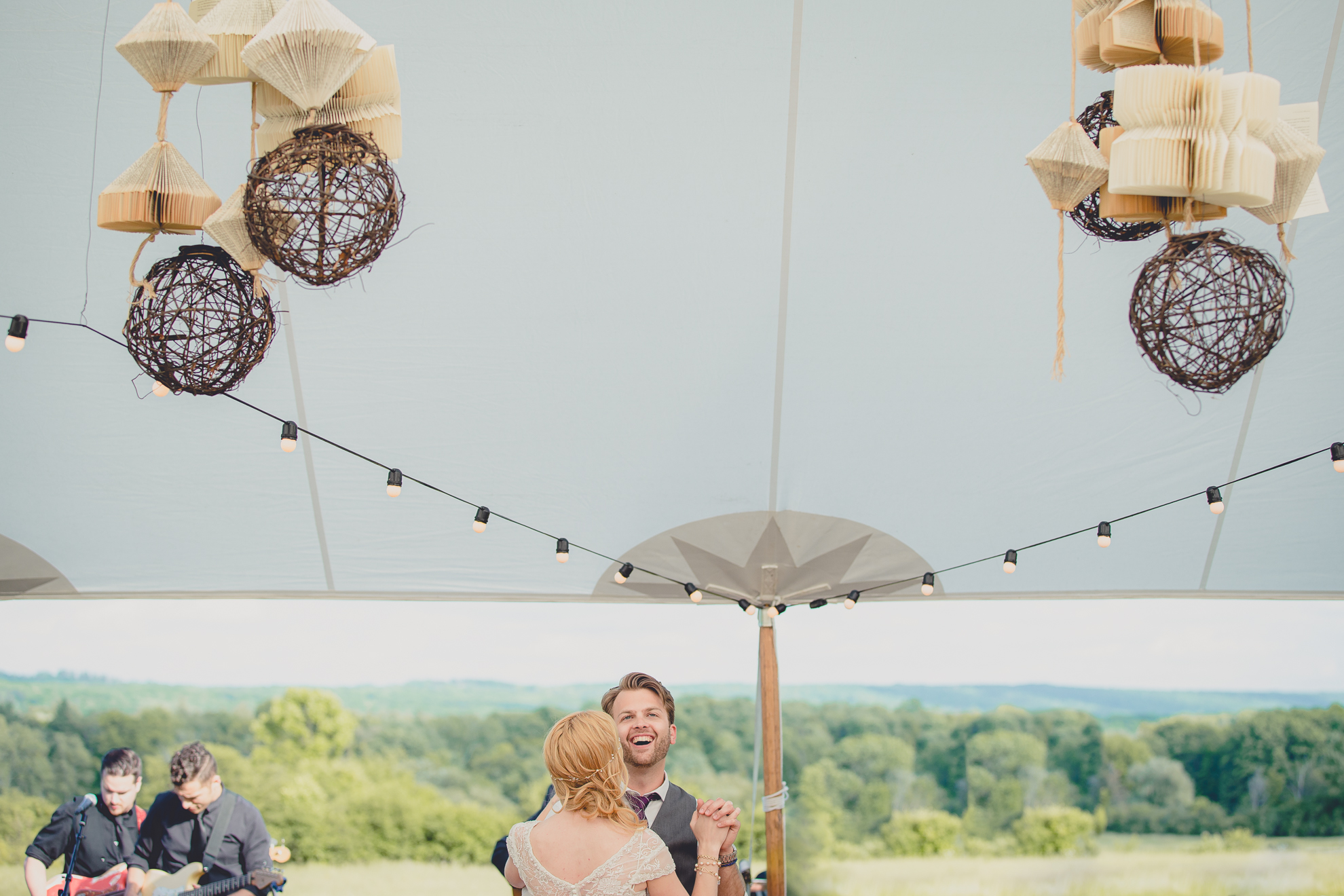 bride and groom share first dance under tent at reception at wedding at Knox Farm near Buffalo, NY