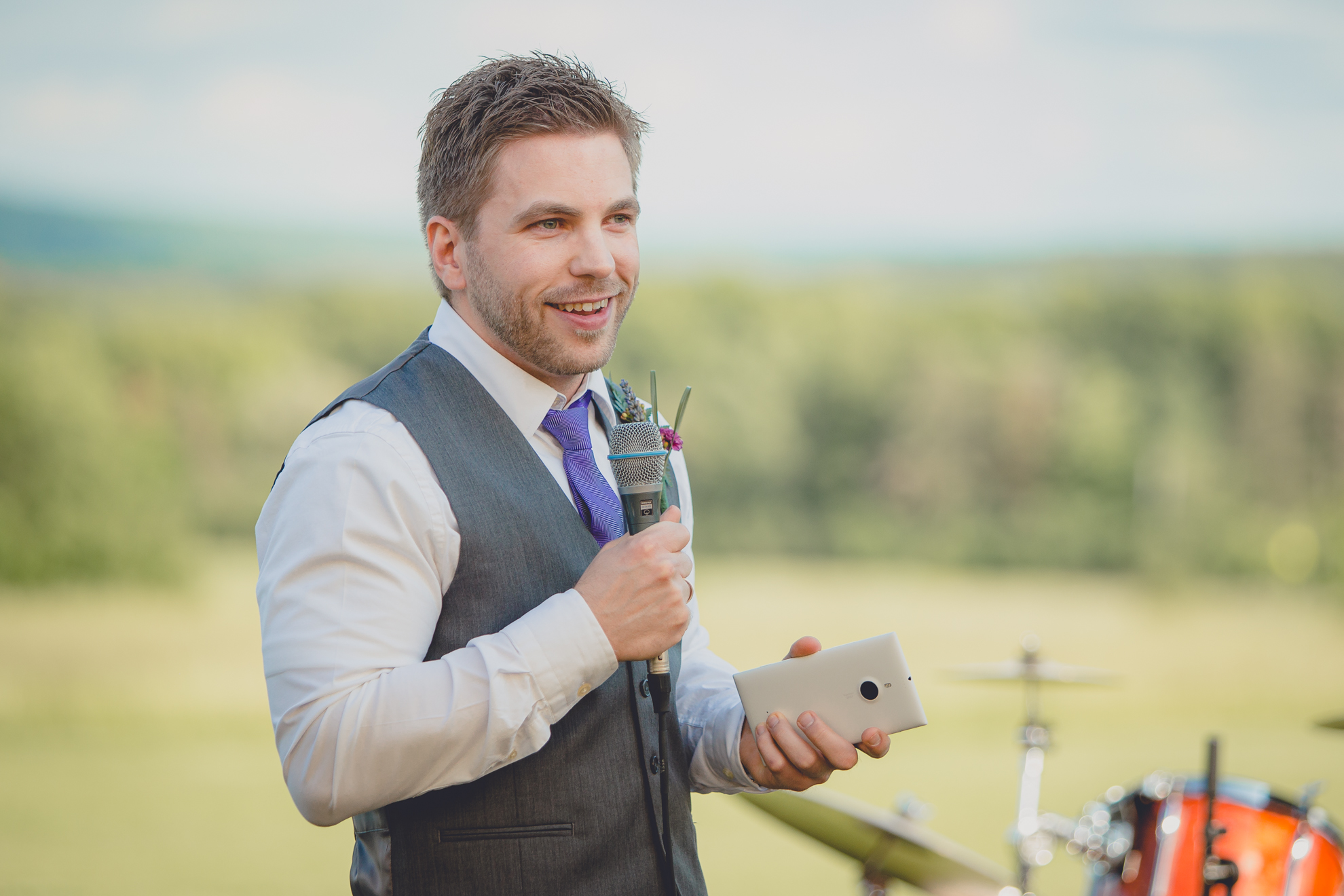 best man delivers speech under tent at reception at wedding at Knox Farm near Buffalo, NY