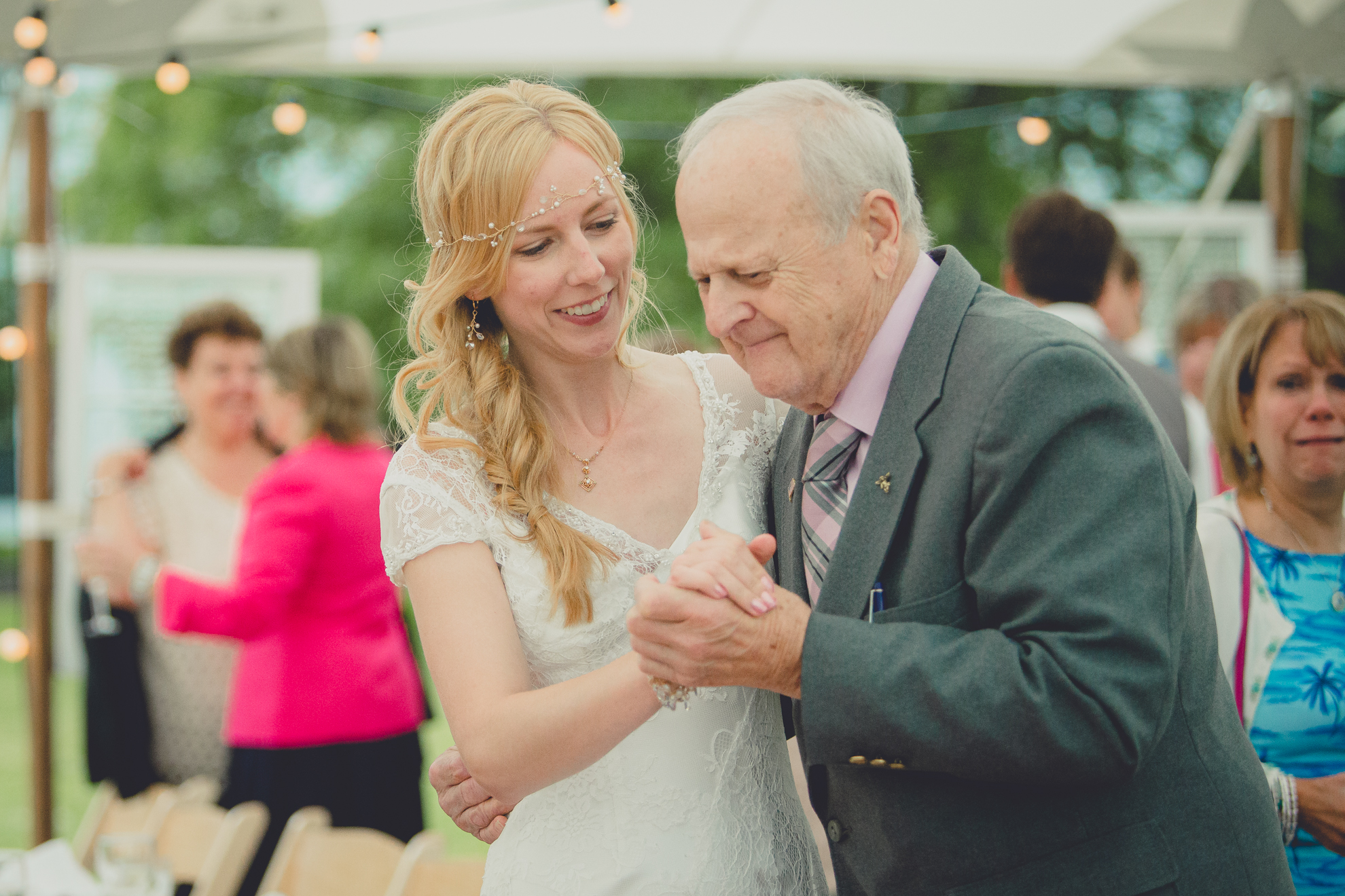 bride dances with grandpa during tented reception at small wedding at Knox Farm near Buffalo, NY