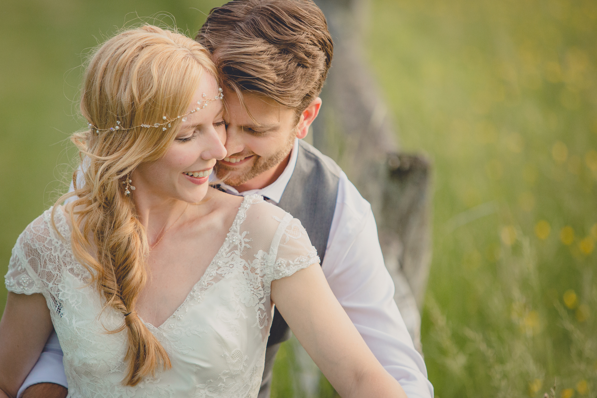 bride and groom pose for portraits in field during reception at small wedding venue Knox Farm in WNY