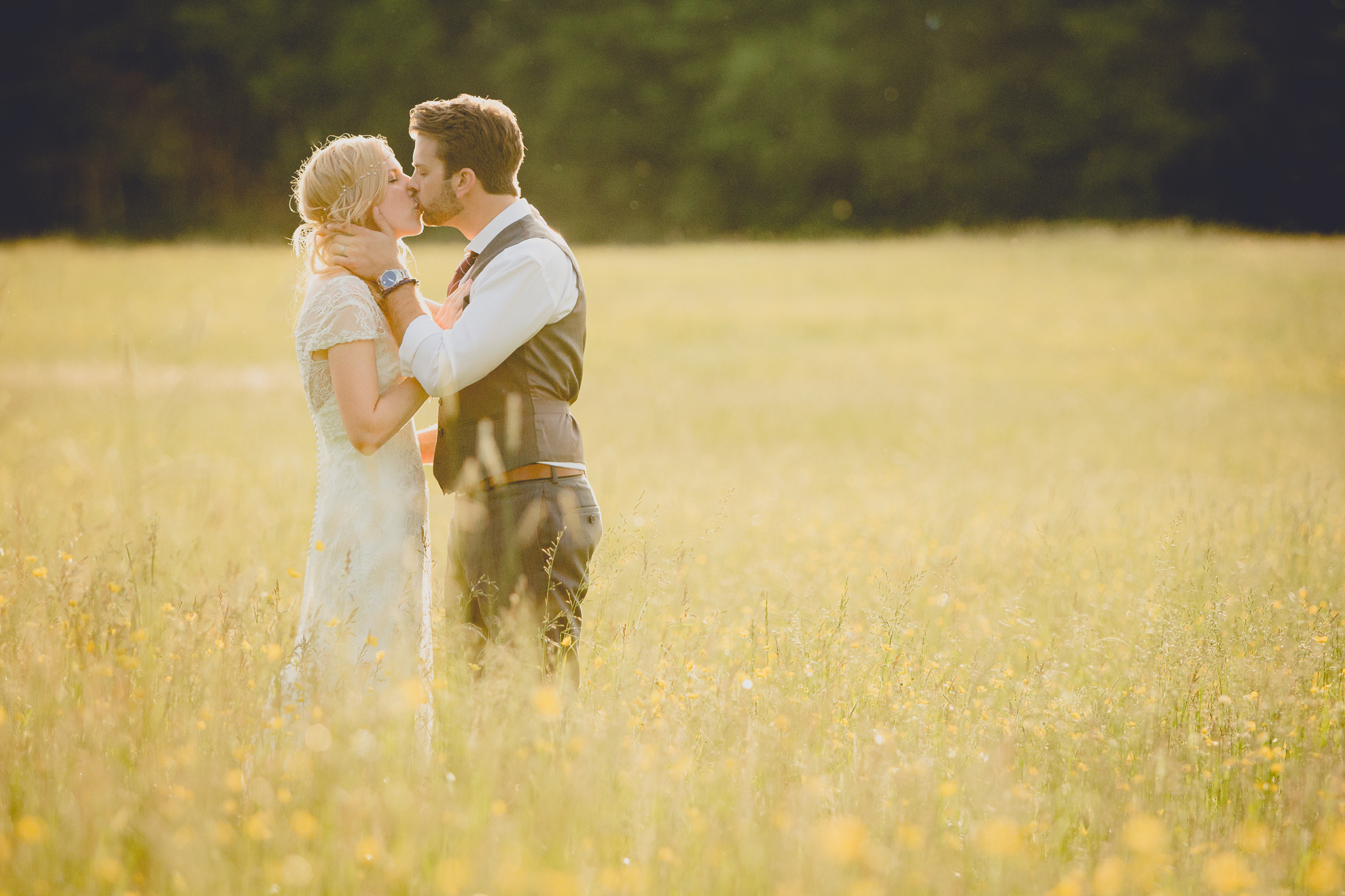 bride and groom pose for portraits in field during reception at small wedding venue Knox Farm in WNY