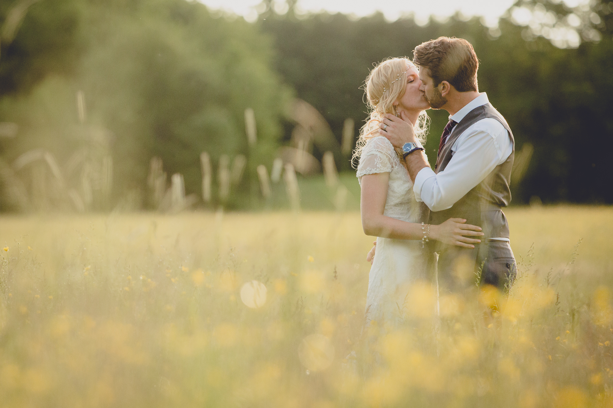 bride and groom pose for portraits in field during reception at small wedding venue Knox Farm in WNY