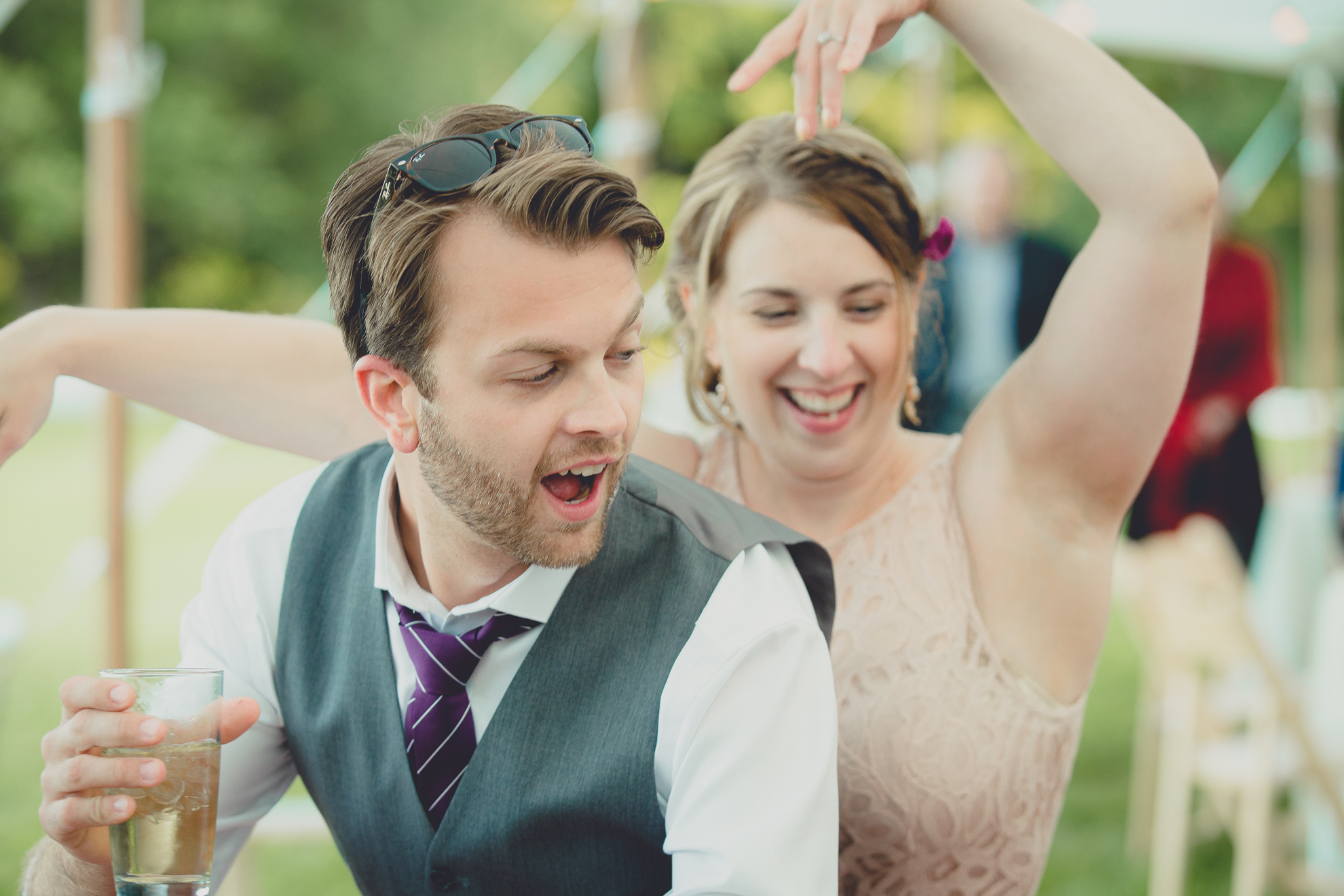 guests dance during tented reception at small wedding venue Knox Farm near Buffalo, NY