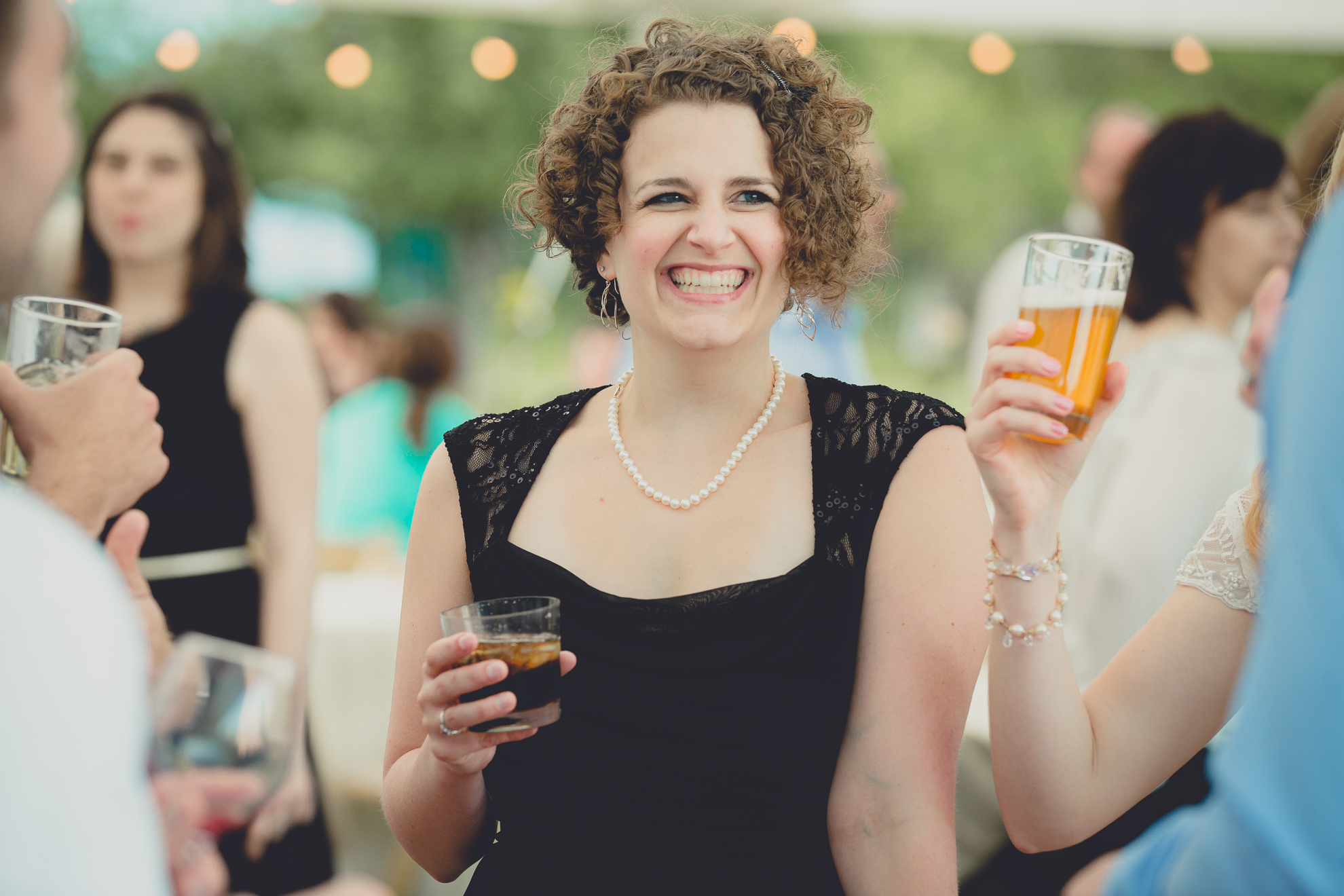 guests dance during tented reception at small wedding venue Knox Farm near Buffalo, NY