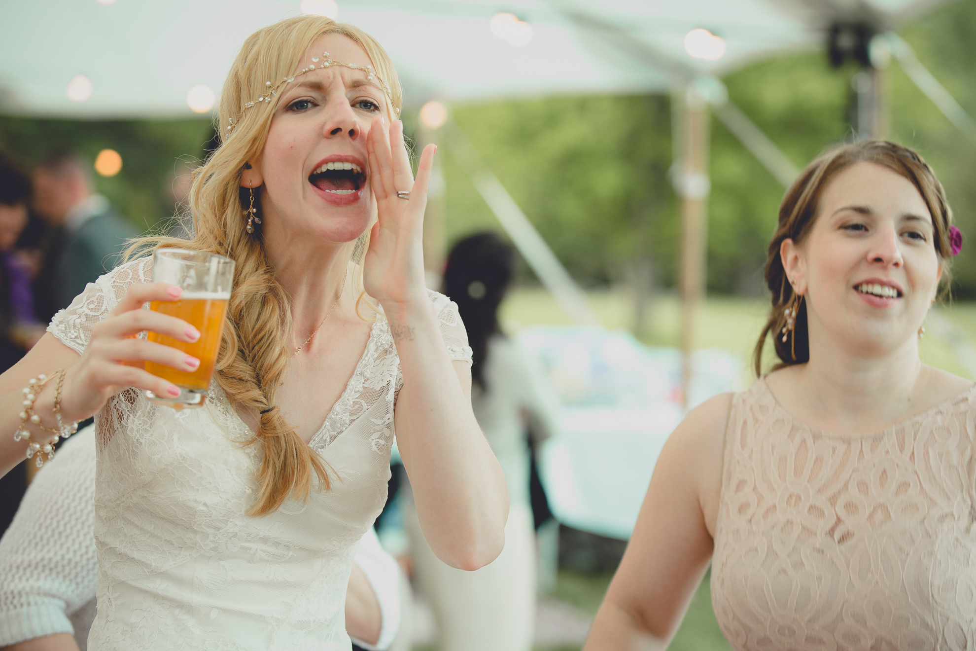 guests dance during tented reception at small wedding venue Knox Farm near Buffalo, NY