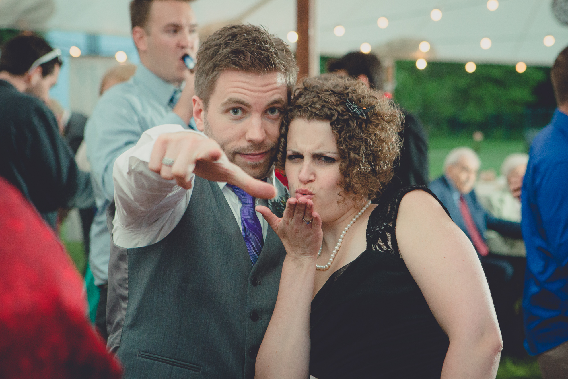 guests dance during tented reception at small wedding venue Knox Farm near Buffalo, NY