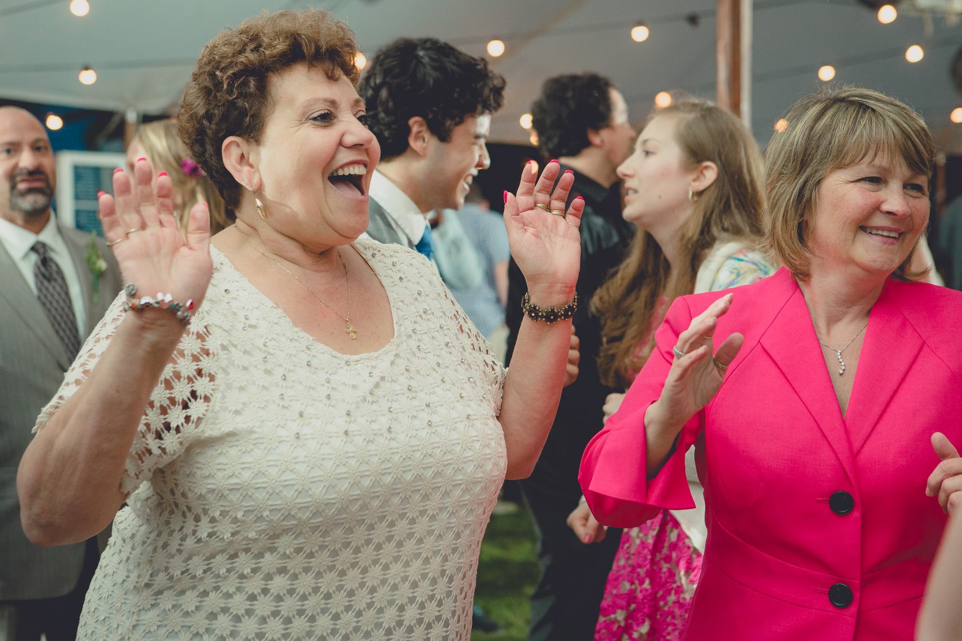 guests dance during tented reception at small wedding venue Knox Farm near Buffalo, NY