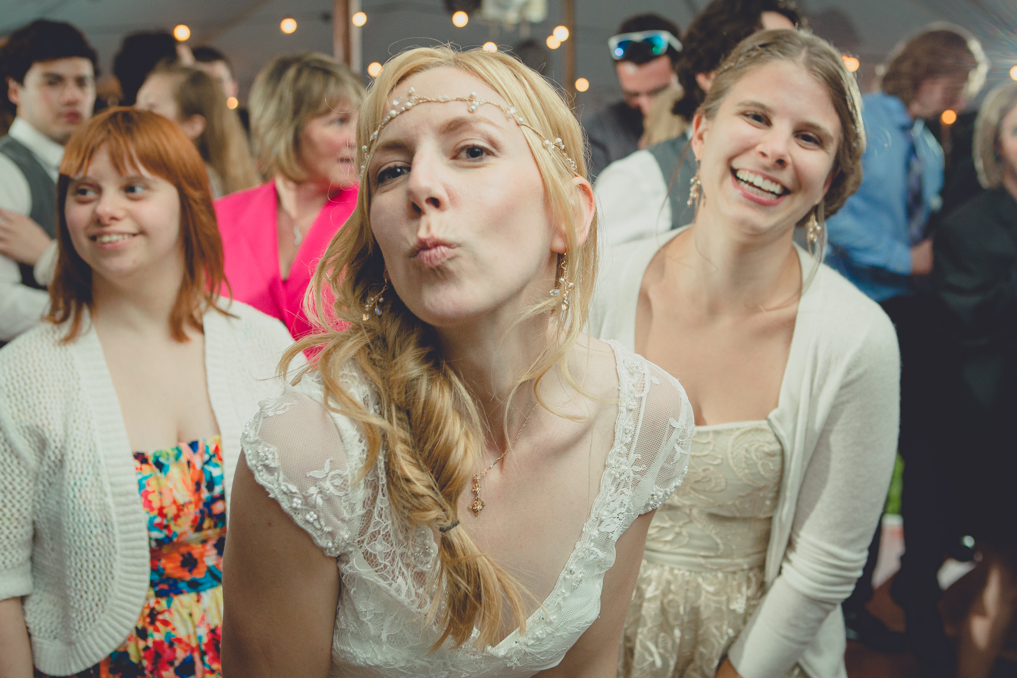 guests dance during tented reception at wedding venue Knox Farm near Buffalo, NY