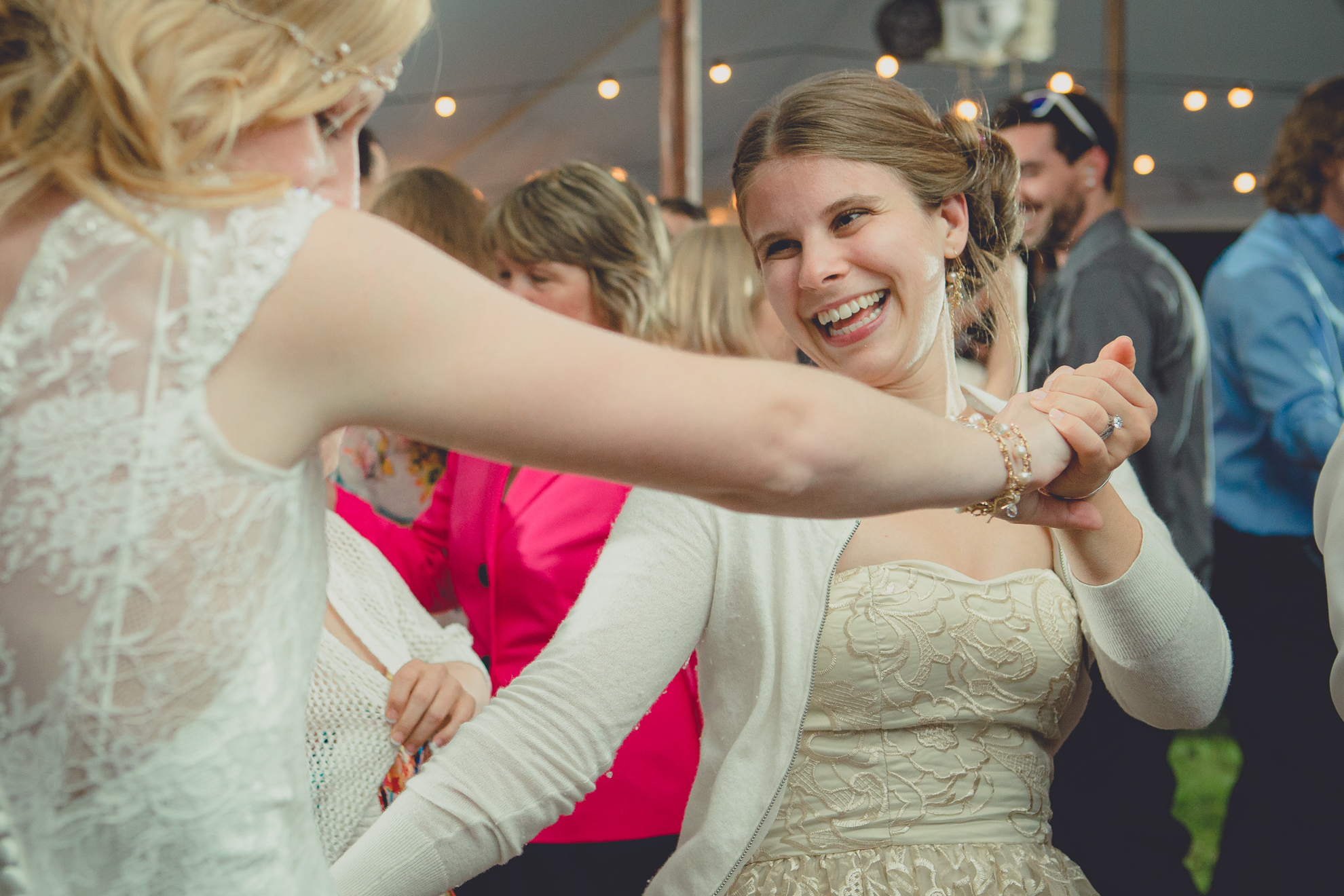 guests dance during tented reception at small wedding venue Knox Farm near Buffalo, NY