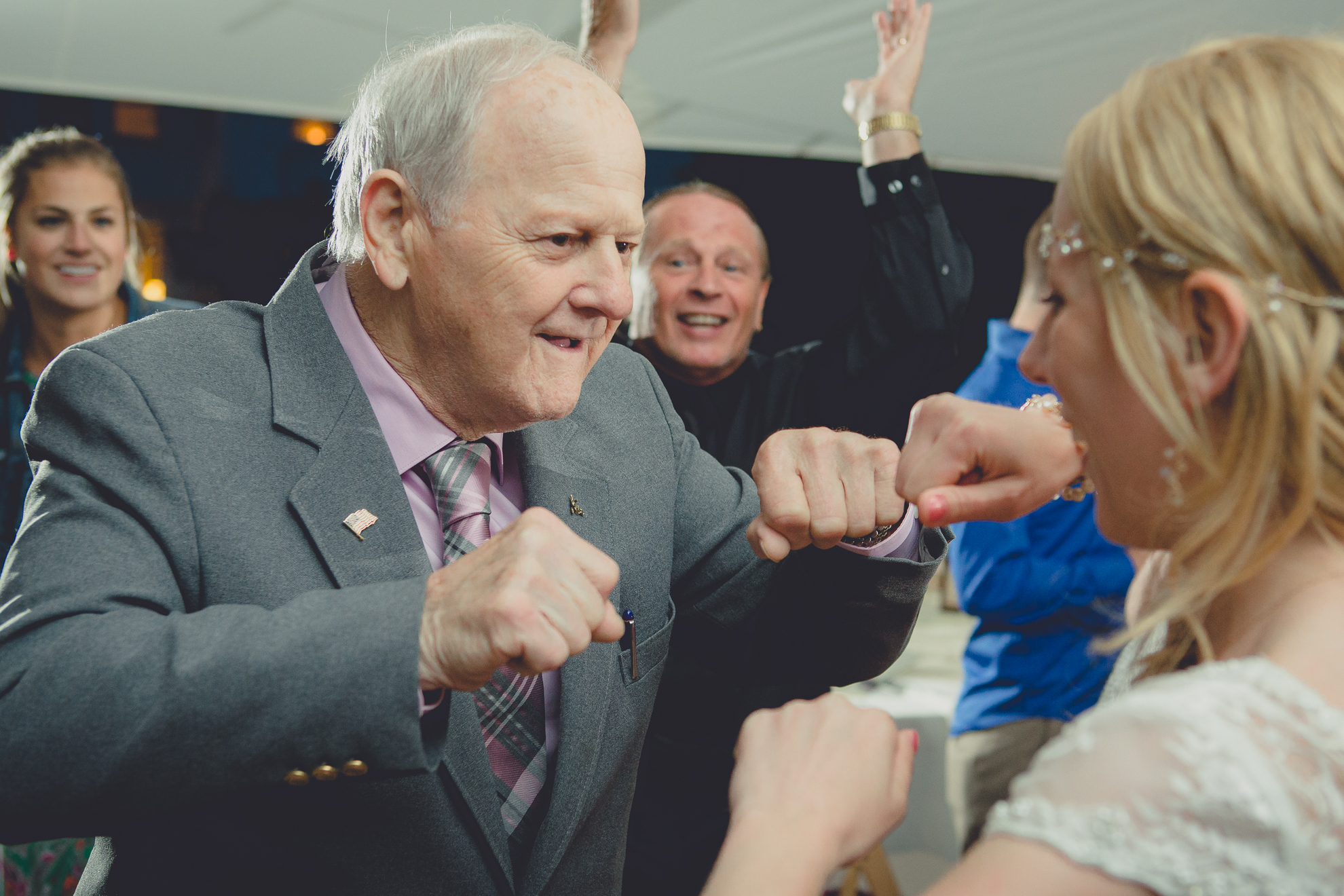 guests dance during tented reception at wedding venue Knox Farm near Buffalo, NY
