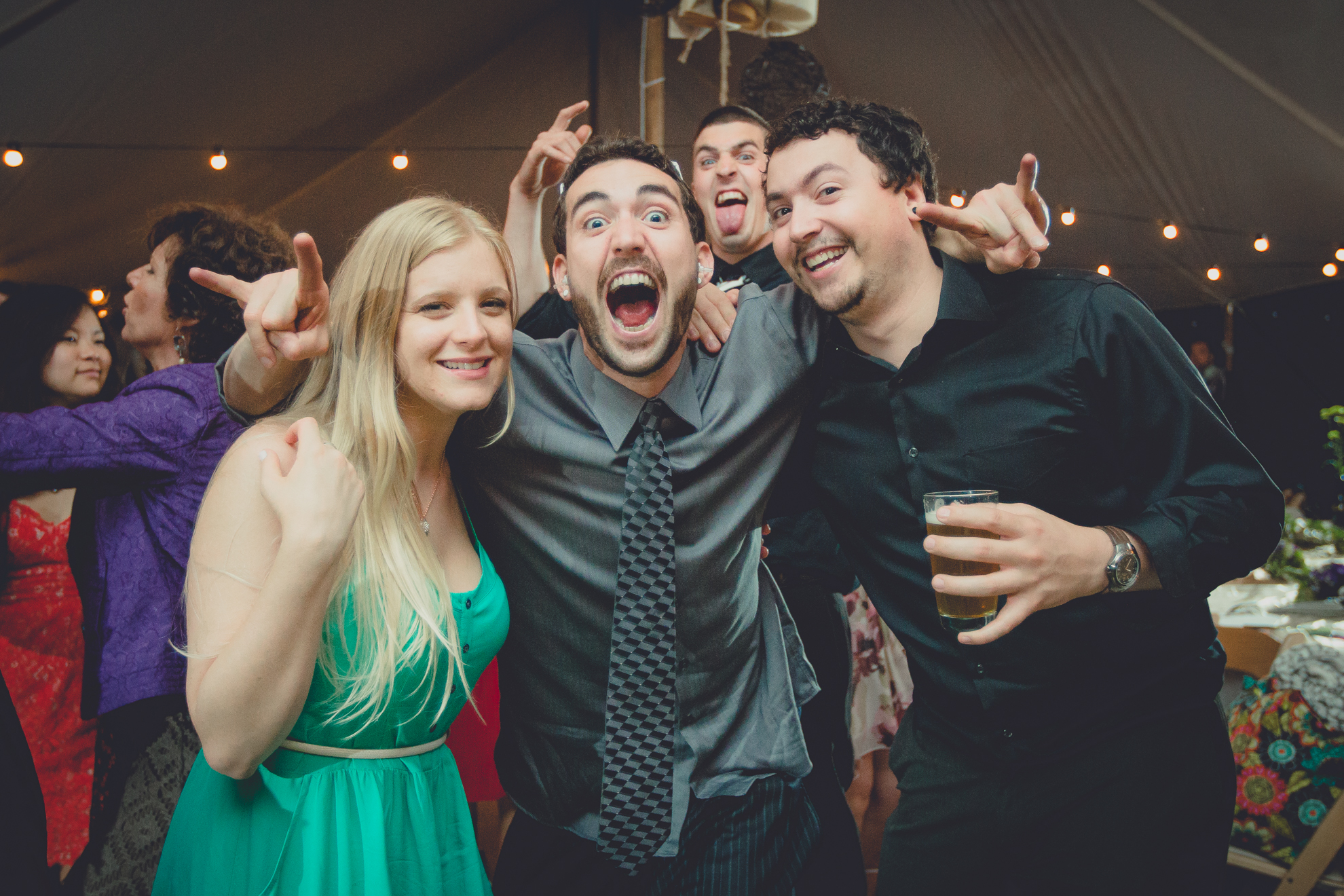 guests dance during tented reception at small wedding venue Knox Farm near Buffalo, NY