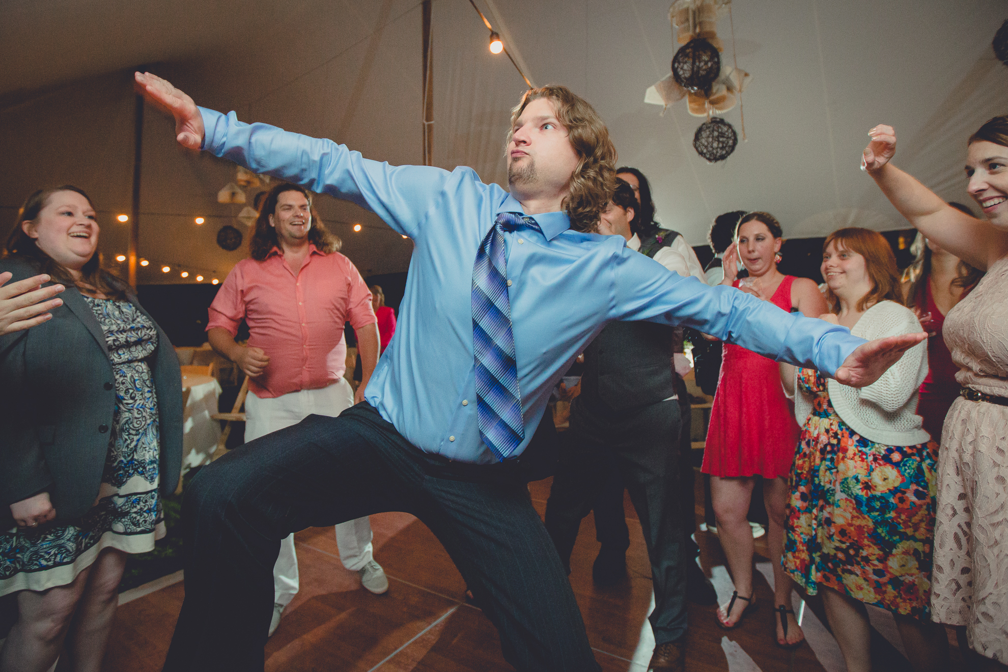 guests dance during tented reception at small wedding venue Knox Farm near Buffalo, NY