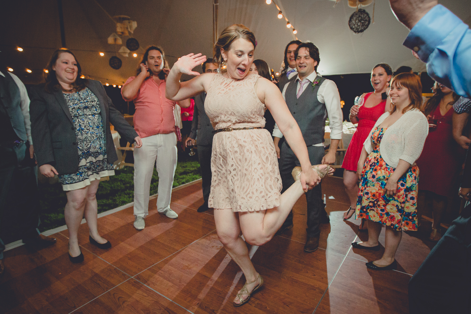 guests dance during tented reception at wedding venue Knox near Buffalo, NY