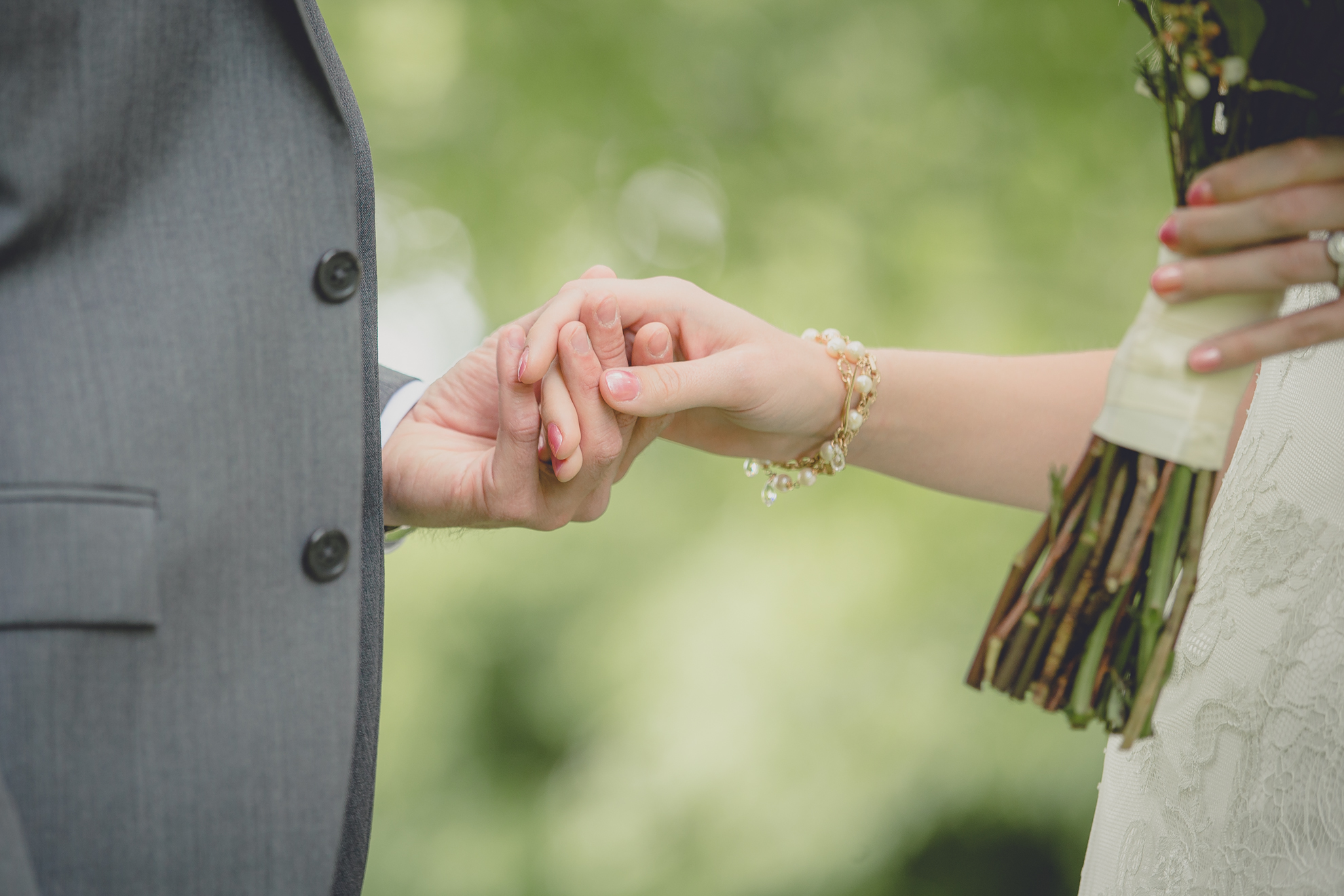 bride and grooms hands as they see each other for the first time during their first look, aka reveal at their small wedding at Knox Farm near Buffalo, NY
