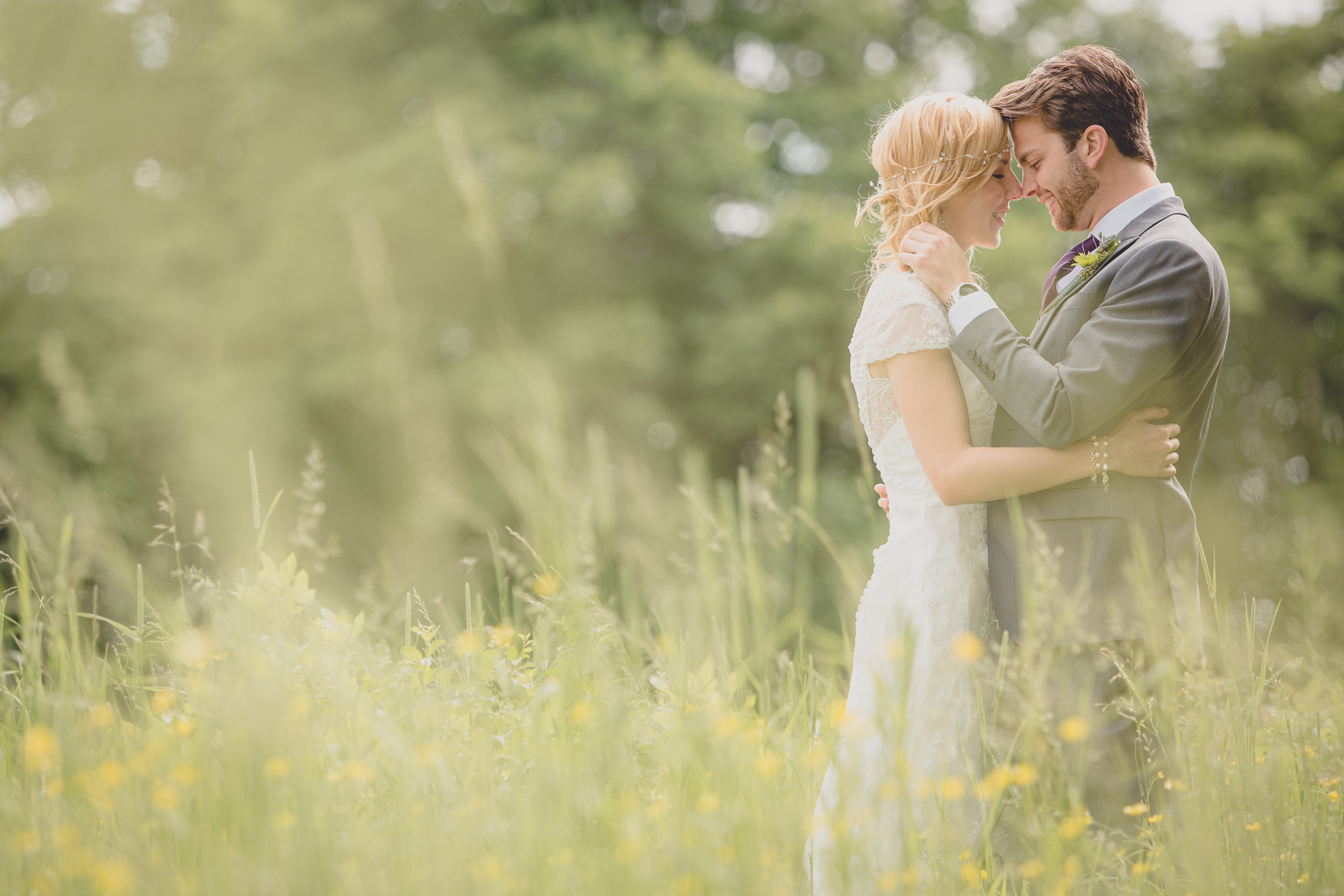bride and groom pose for portraits in field at small wedding at Knox Farm near Buffalo, NY