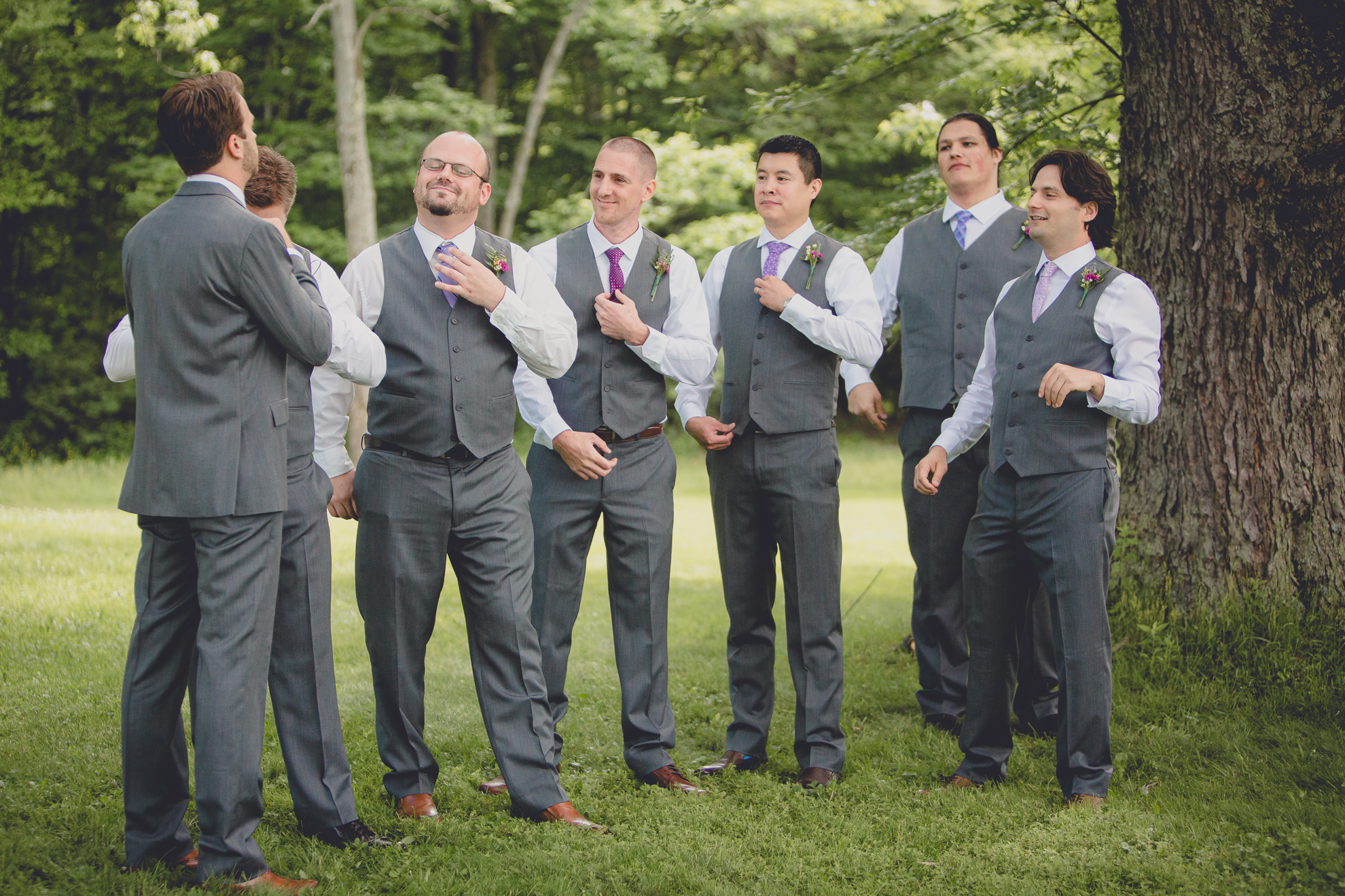 groomsmen straighten ties before ceremony at small wedding at Knox Farm near Buffalo, NY