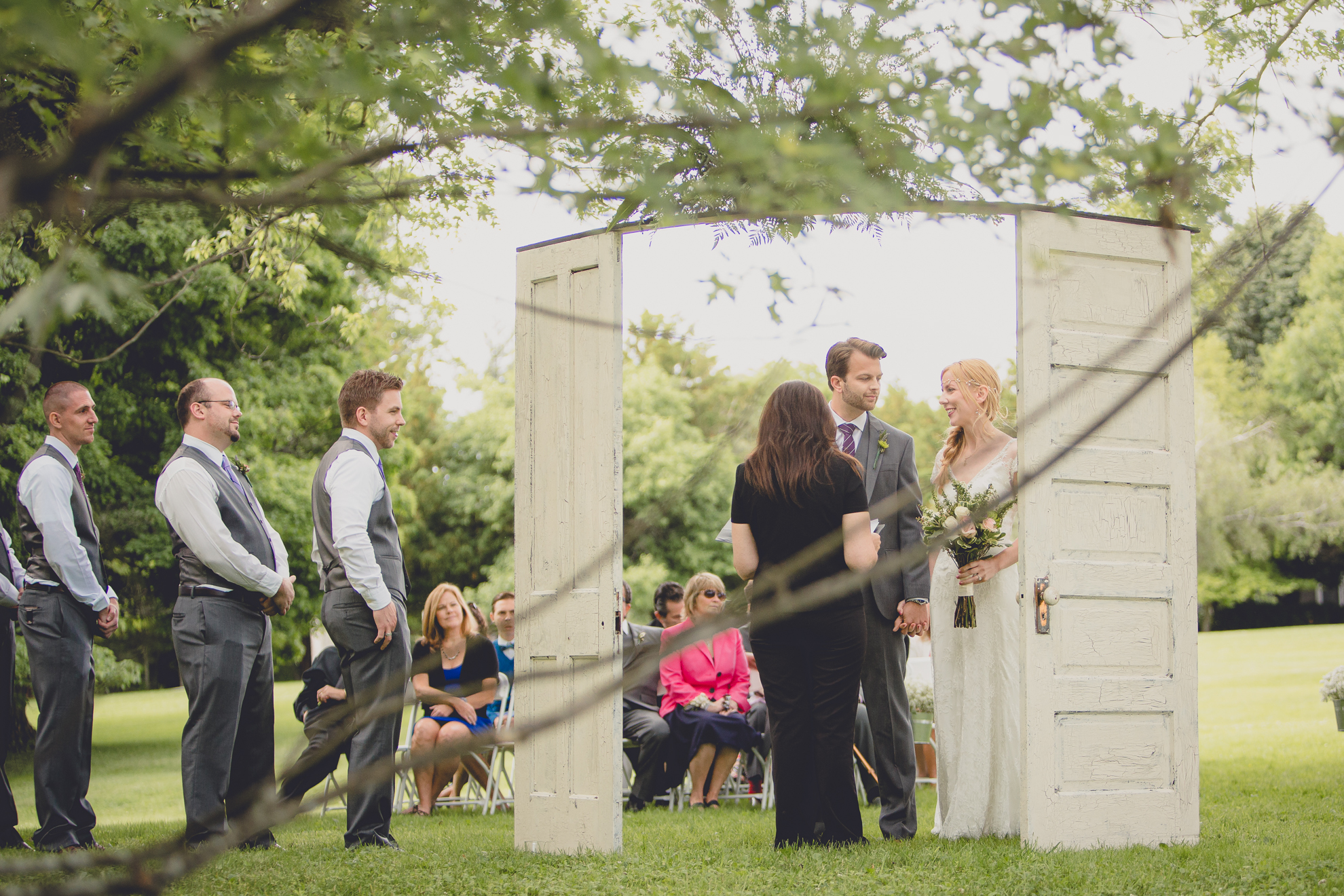 bride and groom look at each other during ceremony at small wedding at Knox Farm near Buffalo, NY