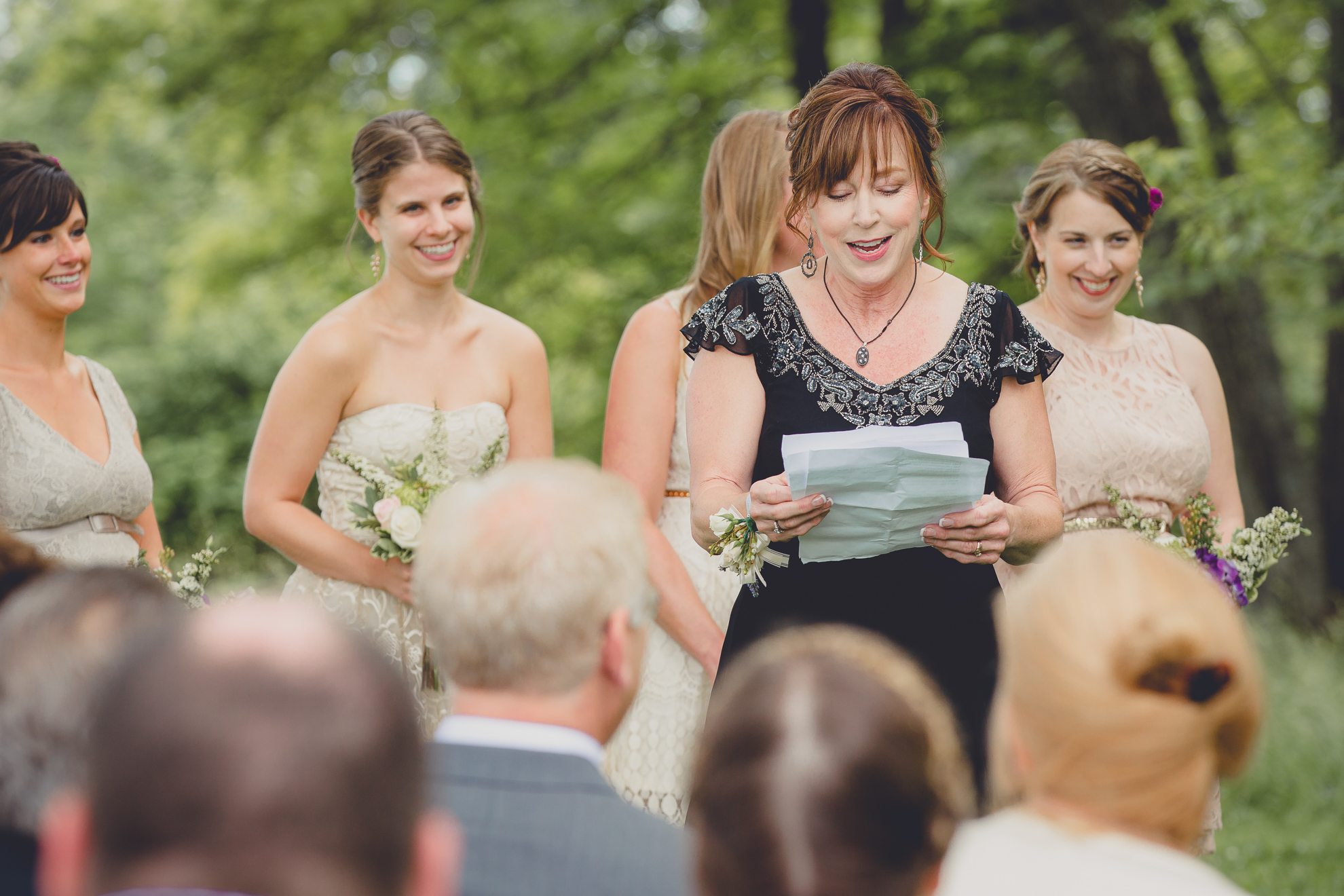 mother of bride reads during ceremony at small wedding at Knox Farm near Buffalo, NY