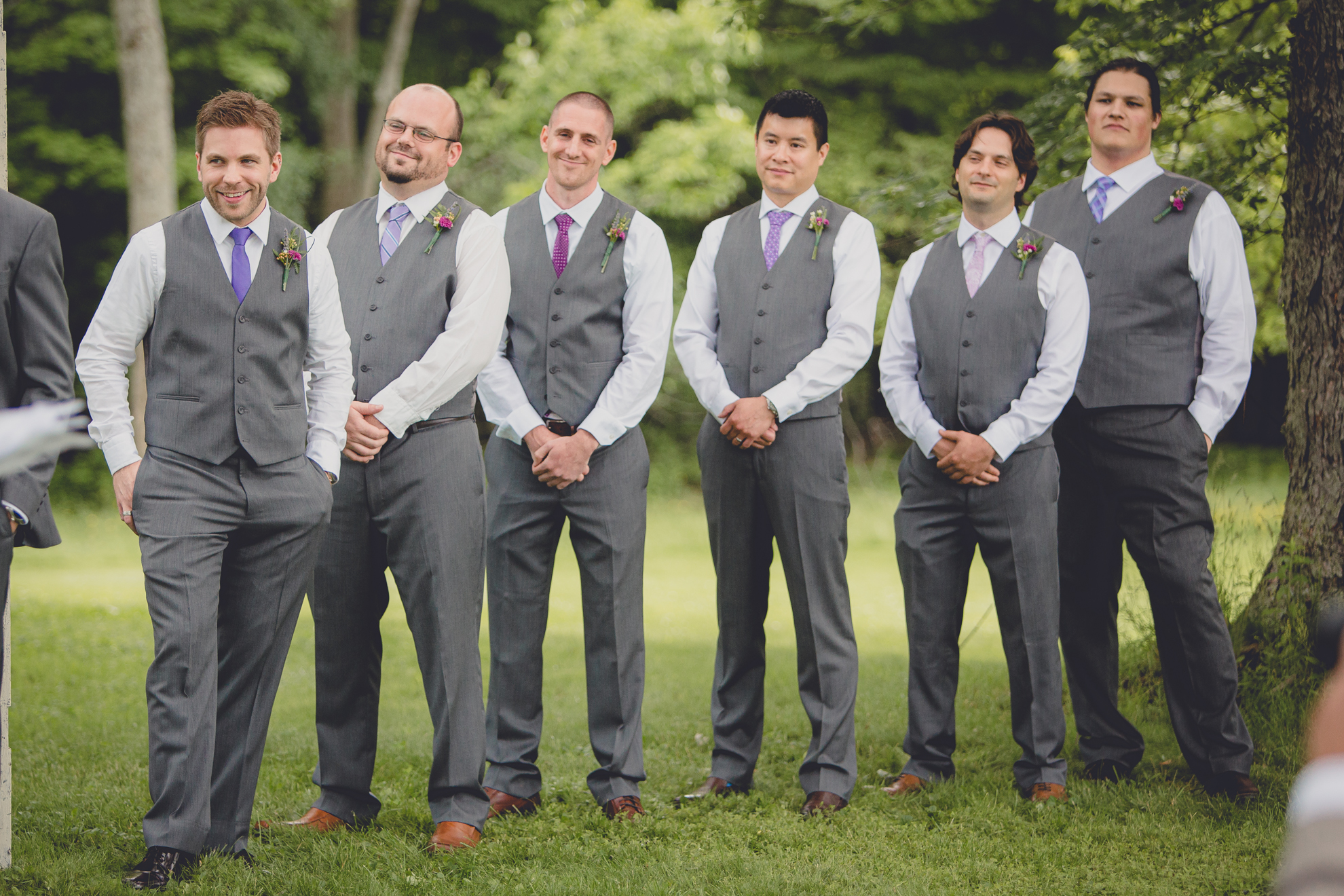 groomsmen smile during ceremony at small wedding at Knox Farm near Buffalo, NY