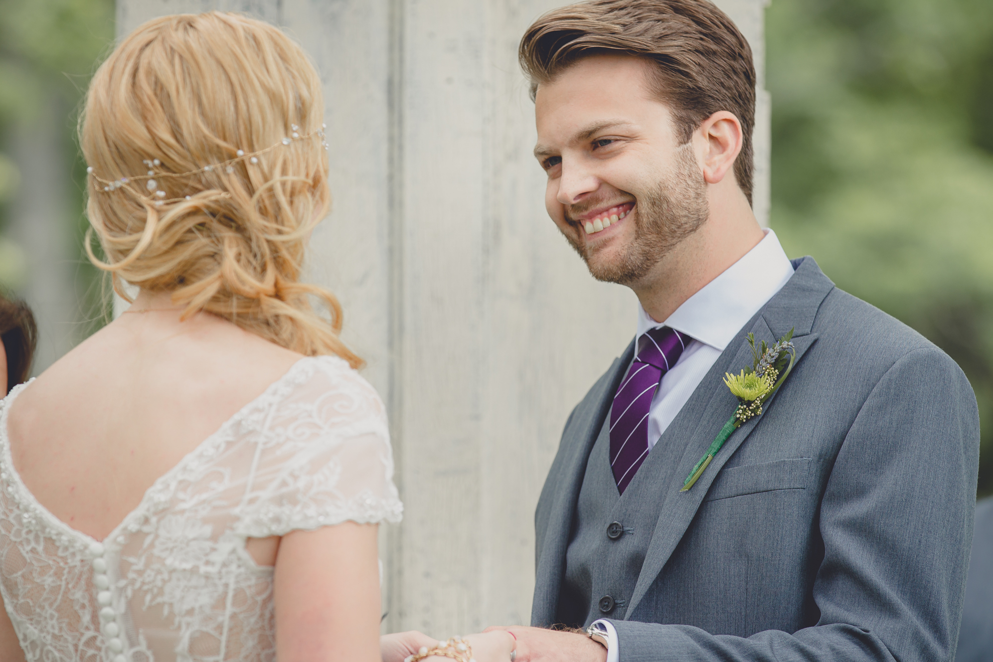 groom smiles at bride during ceremony at small wedding at Knox Farm near Buffalo, NY