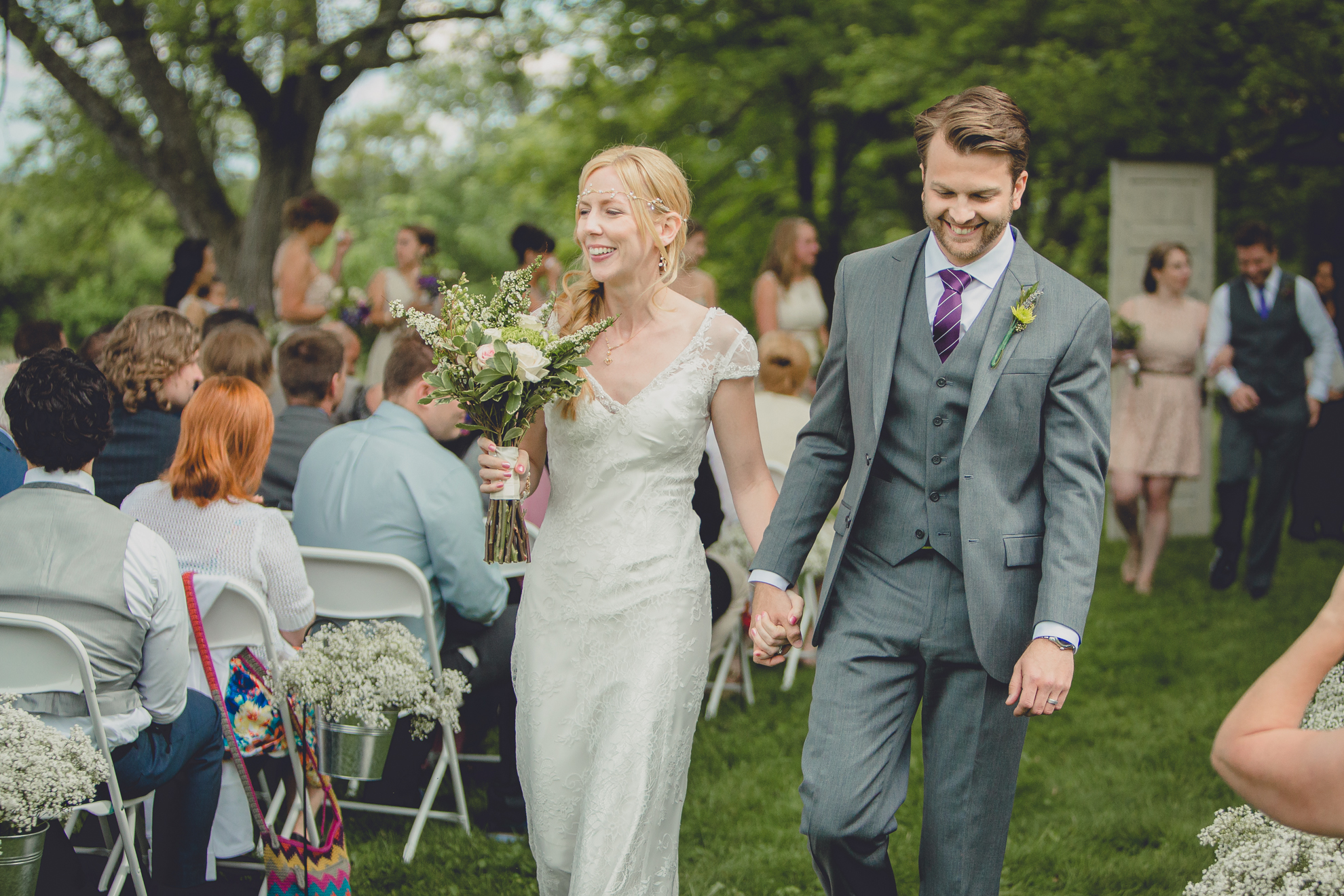 bride and groom walk up aisle during ceremony at wedding at Knox Farm near Buffalo, NY