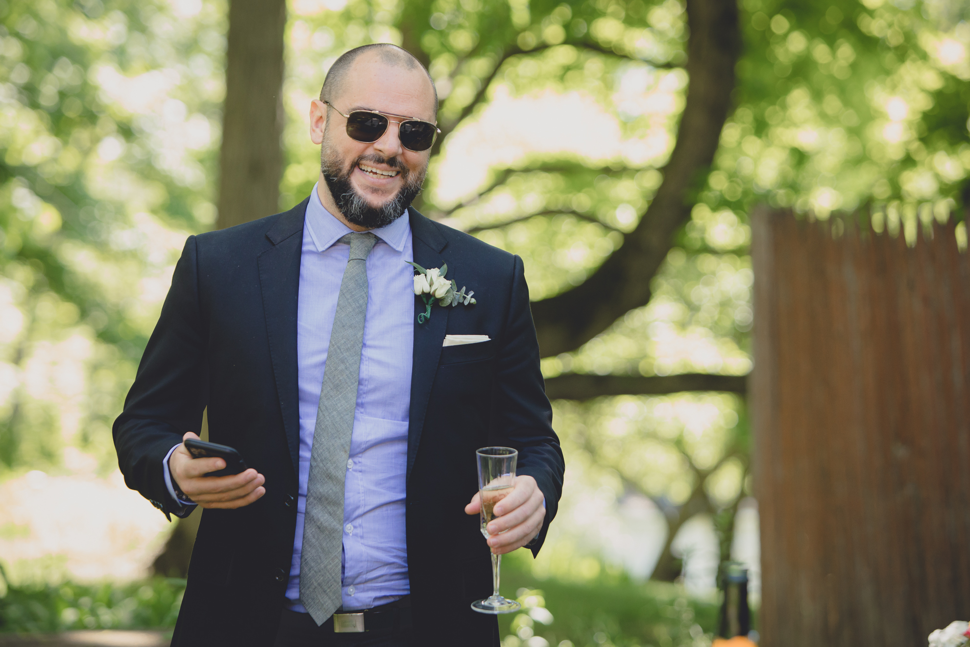 best man delivers speech during small backyard intimate wedding reception in Buffalo, NY