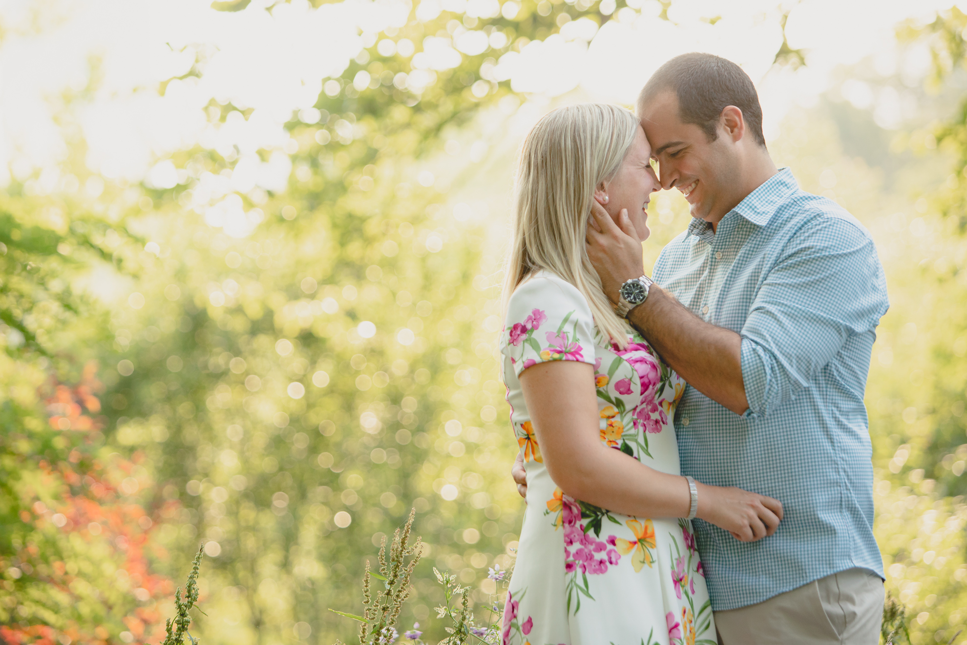 future bride and groom smile at each other on Goat Island during wedding engagement photography session in Niagara Falls, NY