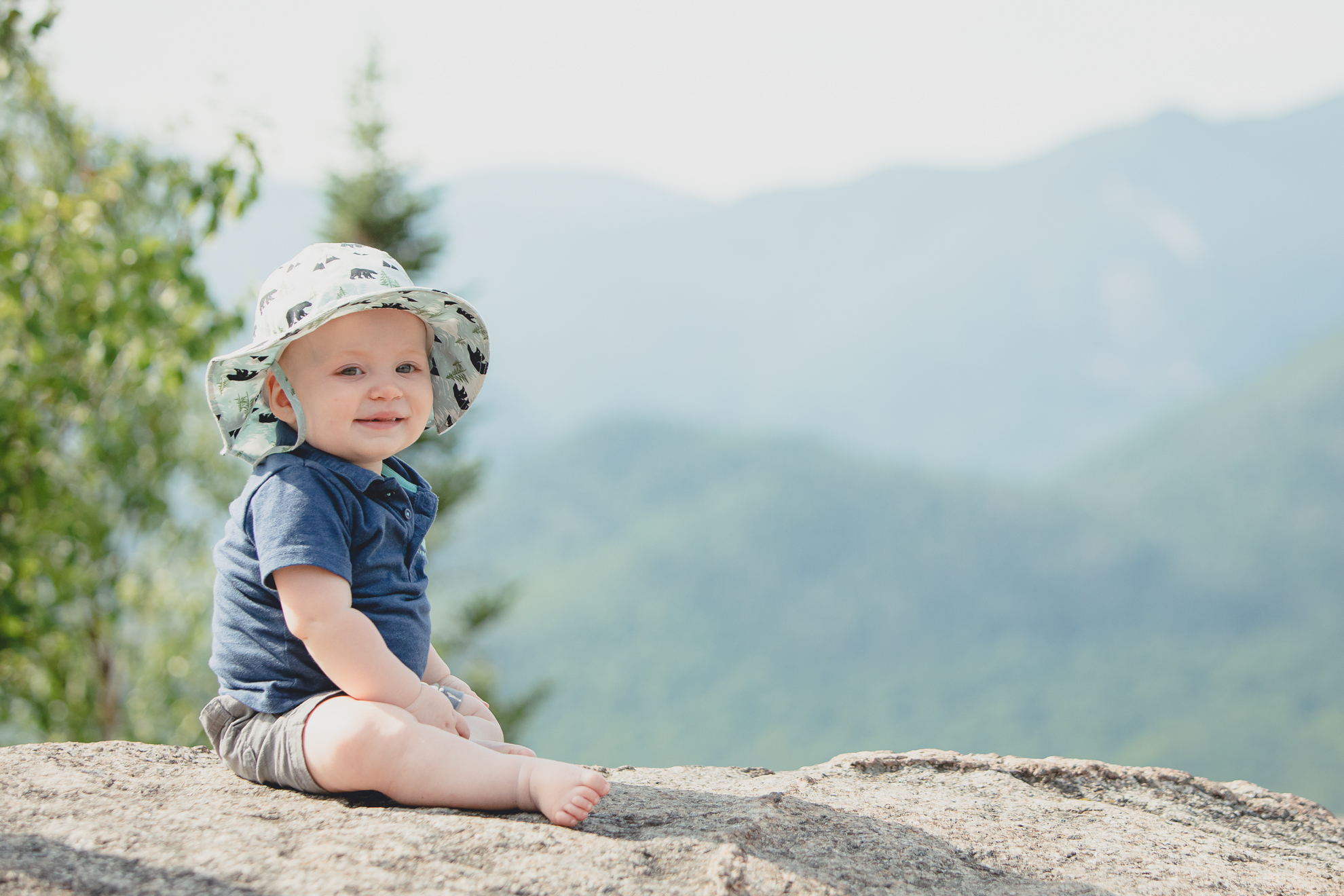 baby on top of Mount Jo during photojournalistic family photography session in the Adirondack High Peaks Region of NY