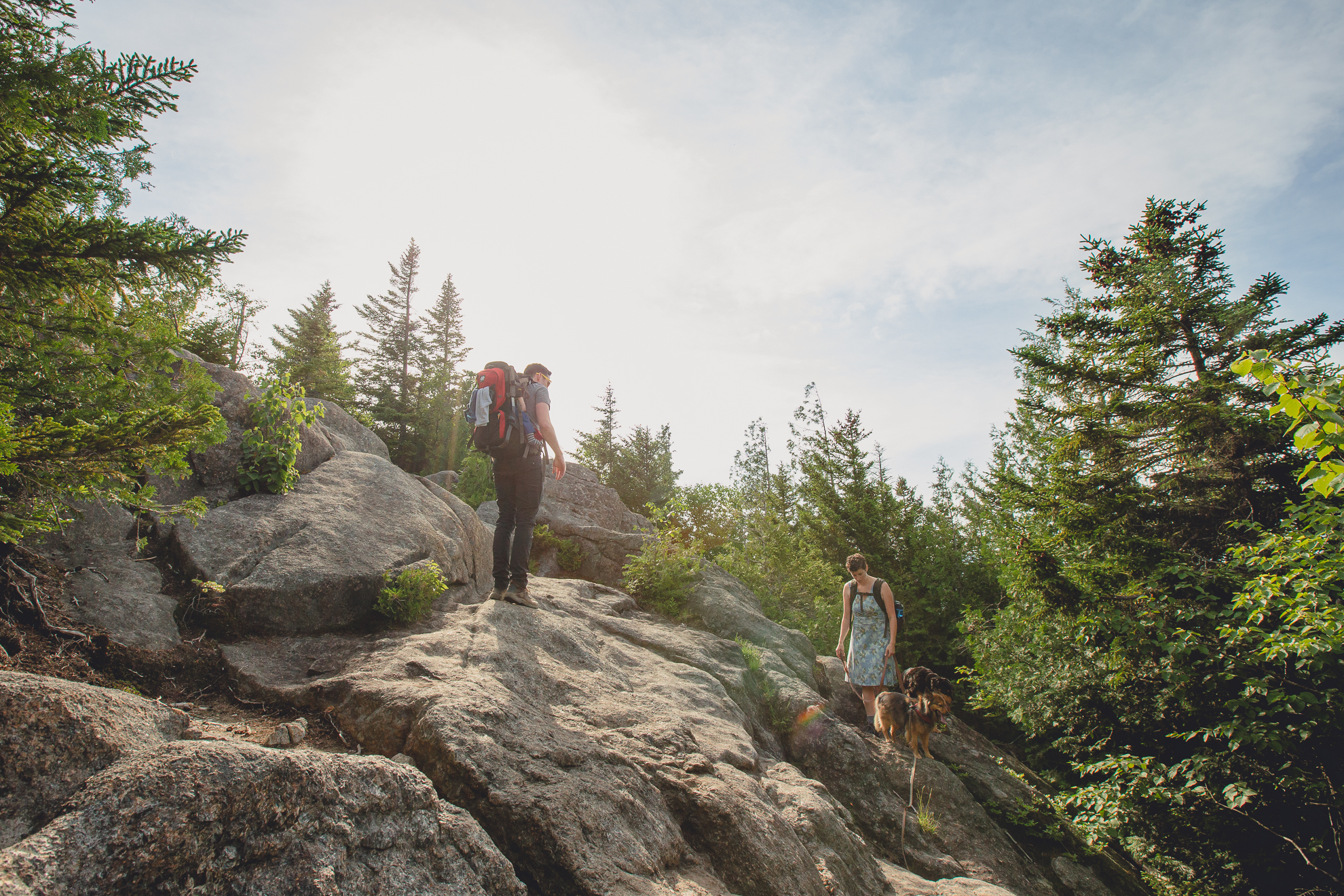 family hikes up Mount Jo during their photojournalistic family photography session in the Adirondack High Peaks Region of NY