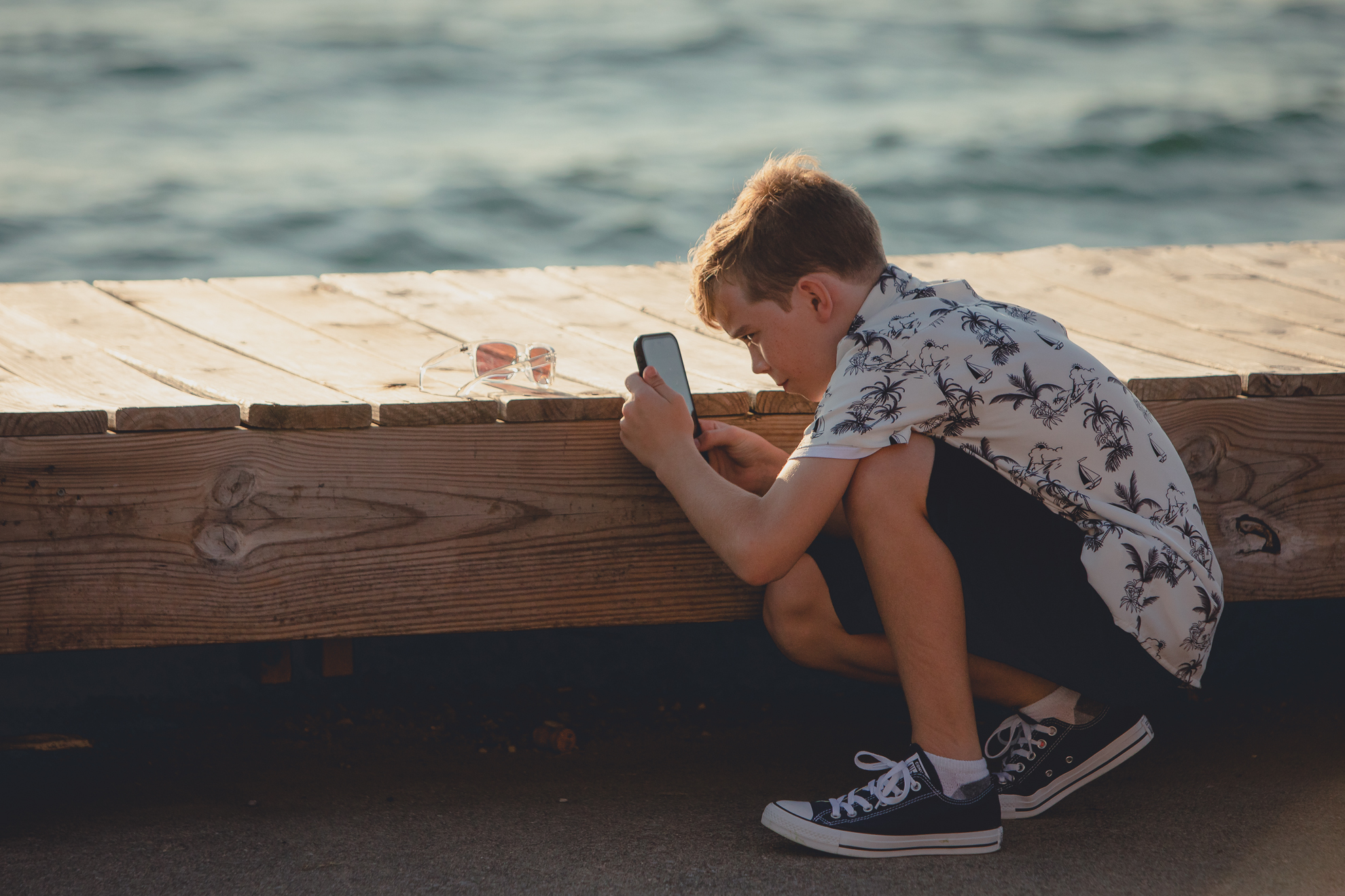 boy takes photos at Youngstown Yacht Club during WNY micro wedding