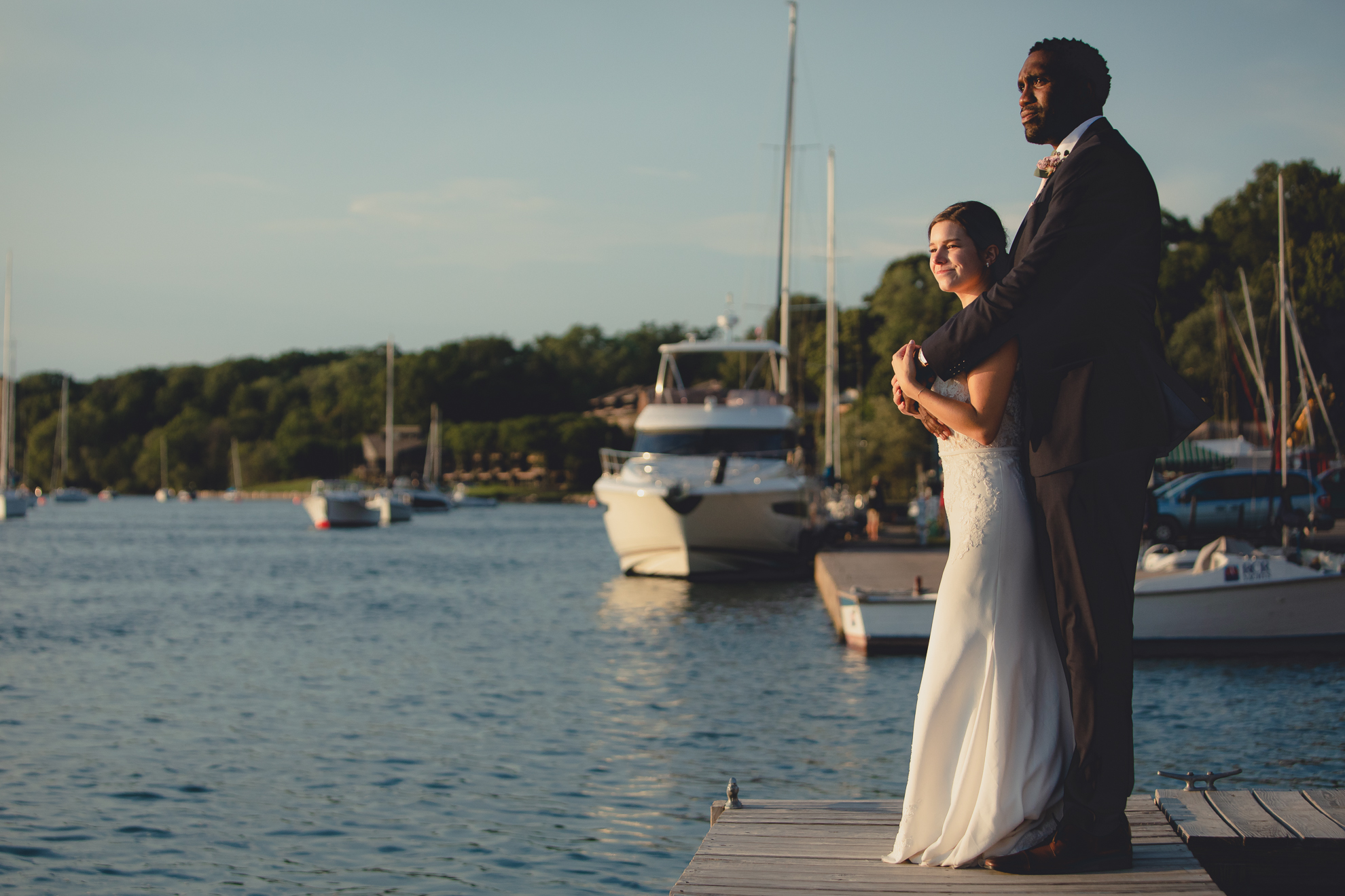 Bride and groom enjoy sunset on dock at Youngstown Yacht Club during WNY micro wedding