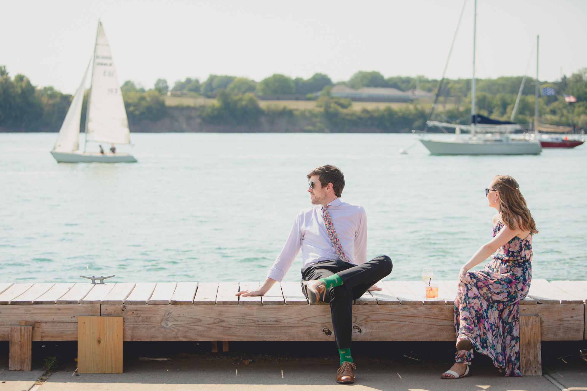 couple sits on dock at Youngstown Yacht Club during WNY micro wedding