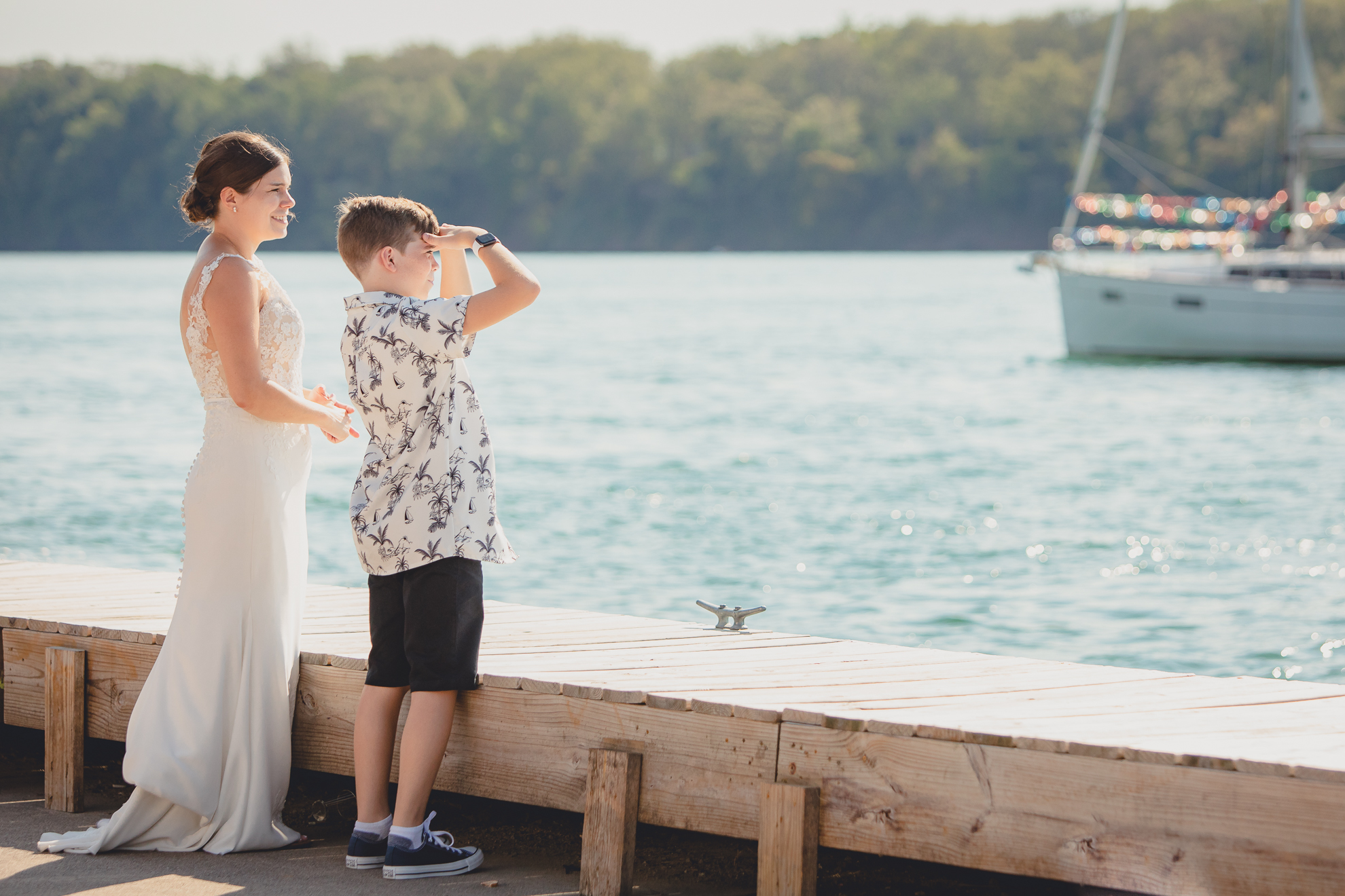 bride and nephew look out on Niagara River at Youngstown Yacht Club during WNY micro wedding