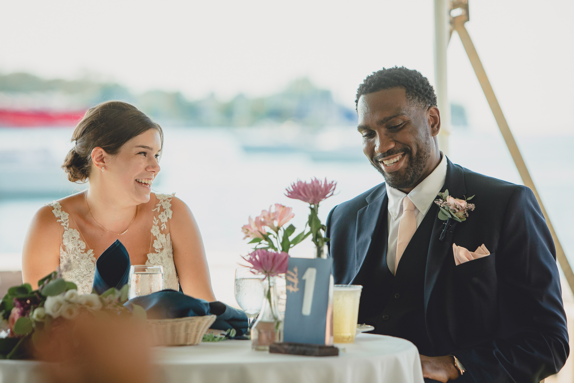 bride and groom laugh during at Youngstown Yacht Club during WNY micro wedding