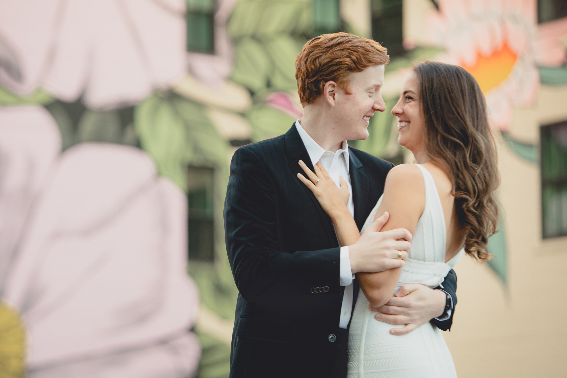 Courtney Woods and John Stevens wedding engagement portrait photography at Wildflowers for Buffalo mural in Buffalo, NY