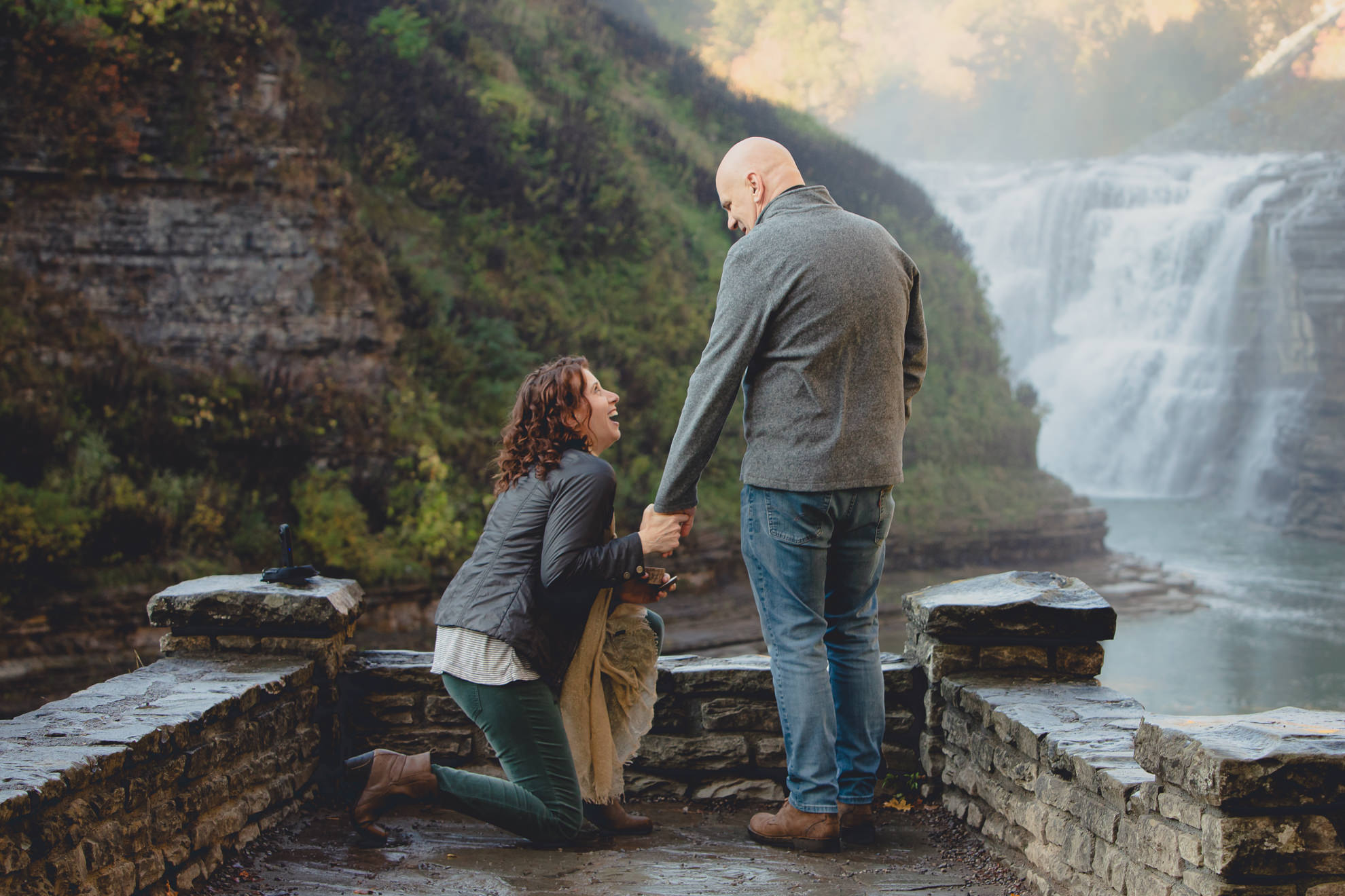 bride proposes to groom in front of Upper Falls at Letchworth State Park near Buffalo, NY