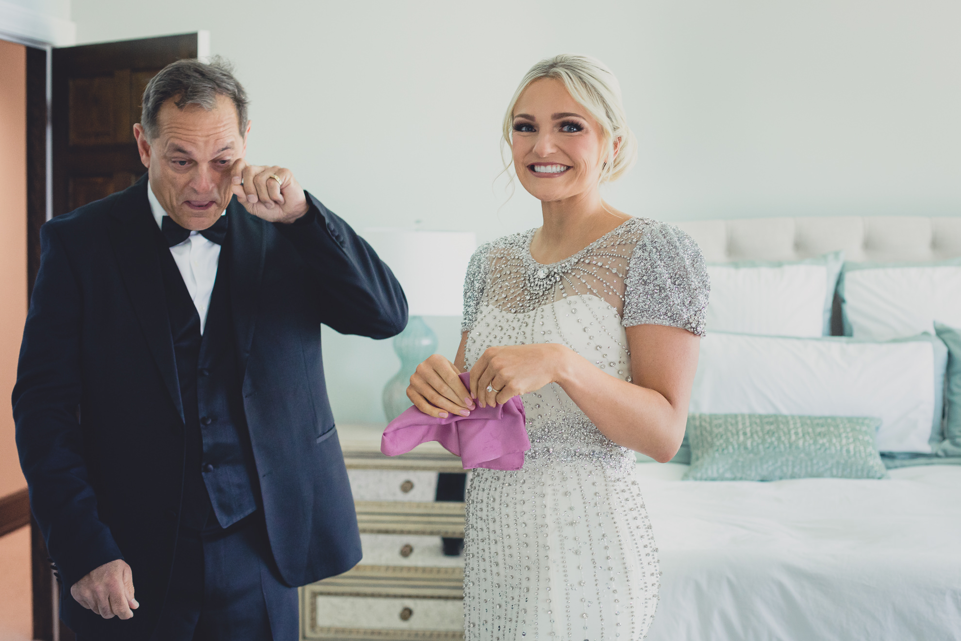 bride with handkerchief gifted by her dad before wedding in Lewiston, NY