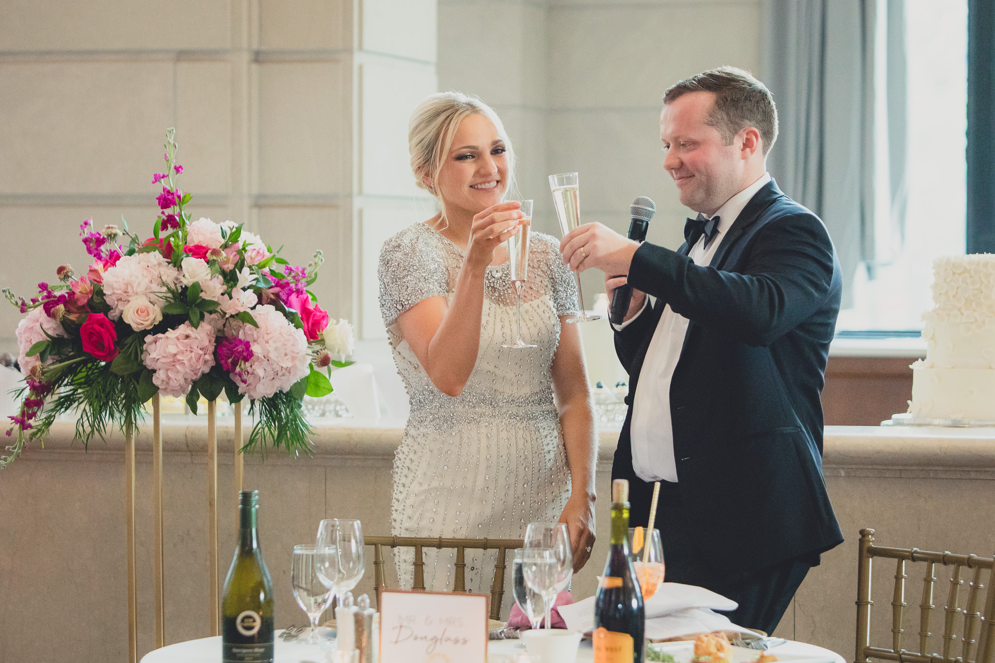 bride and groom toast after speech at Admiral Room Ballroom wedding reception venue in downtown Buffalo, NY