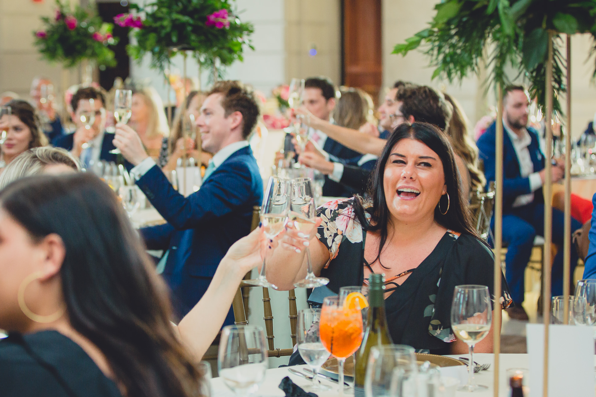 guests toast after speech at Admiral Room Ballroom wedding reception venue in downtown Buffalo, NY