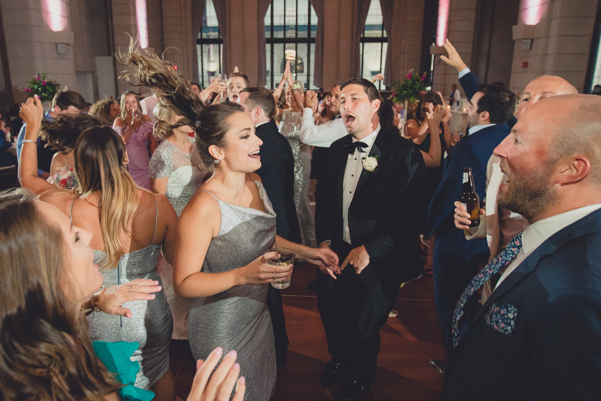 Guests dance in the Admiral Room Ballroom wedding reception venue in downtown Buffalo, NY