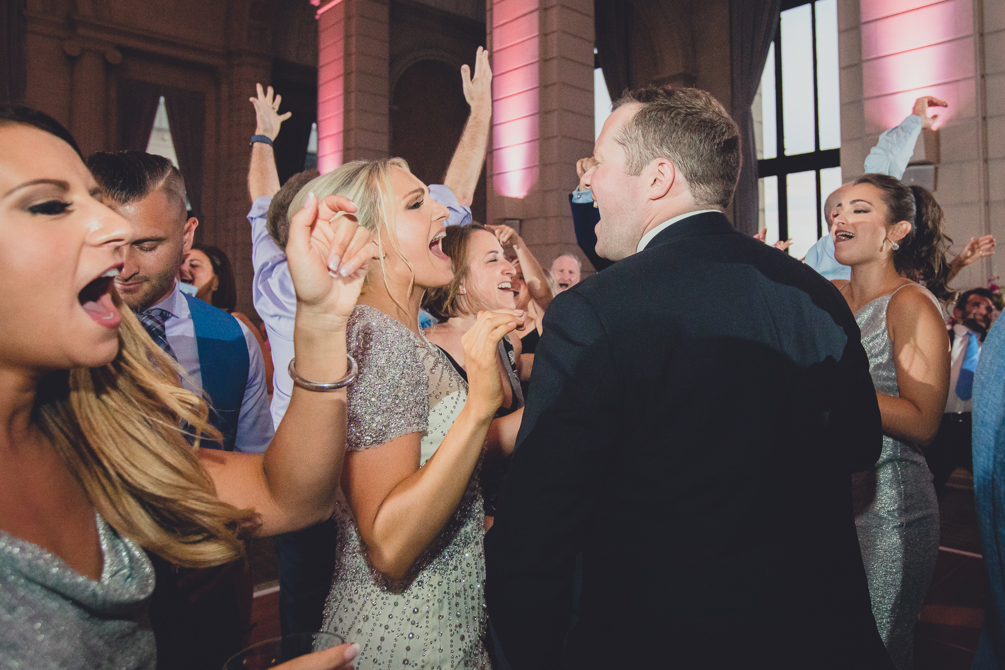 Guests dance in the Admiral Room Ballroom wedding reception venue in downtown Buffalo, NY