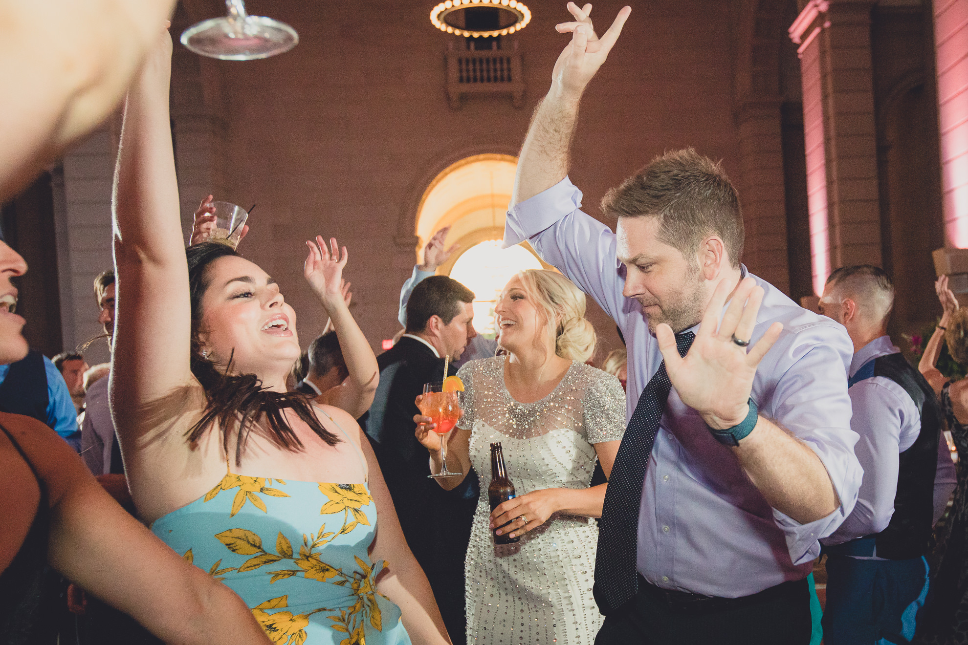 Guests dance in the Admiral Room Ballroom wedding reception venue in downtown Buffalo, NY