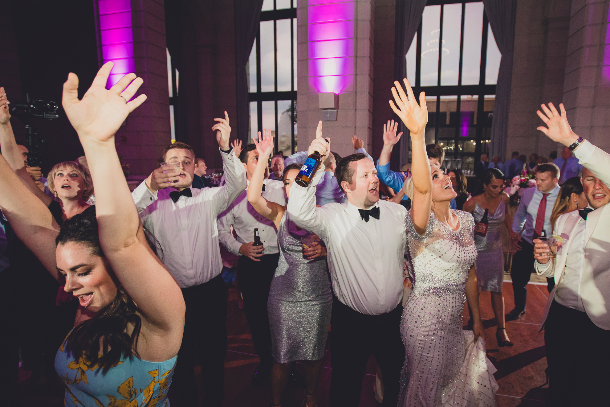Guests dance in the Admiral Room Ballroom wedding reception venue in downtown Buffalo, NY
