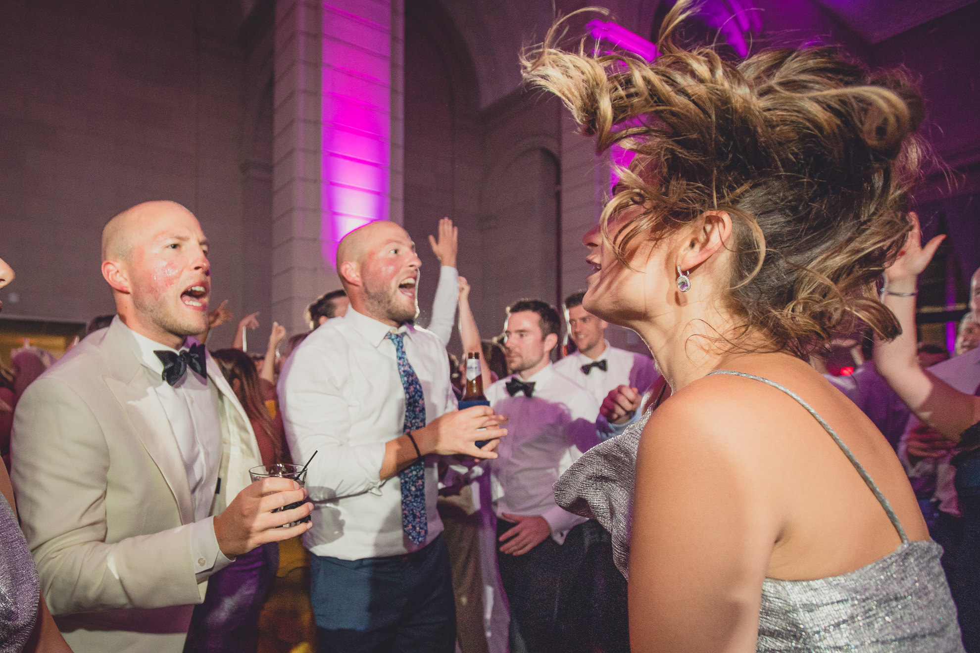 Guests dance in the Admiral Room Ballroom wedding reception venue in downtown Buffalo, NY