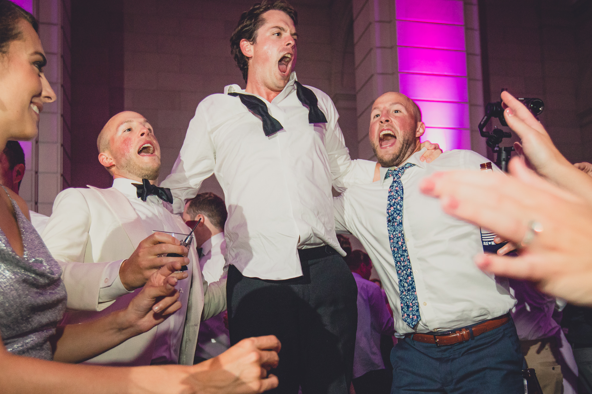 Guests dance in the Admiral Room Ballroom wedding reception venue in downtown Buffalo, NY