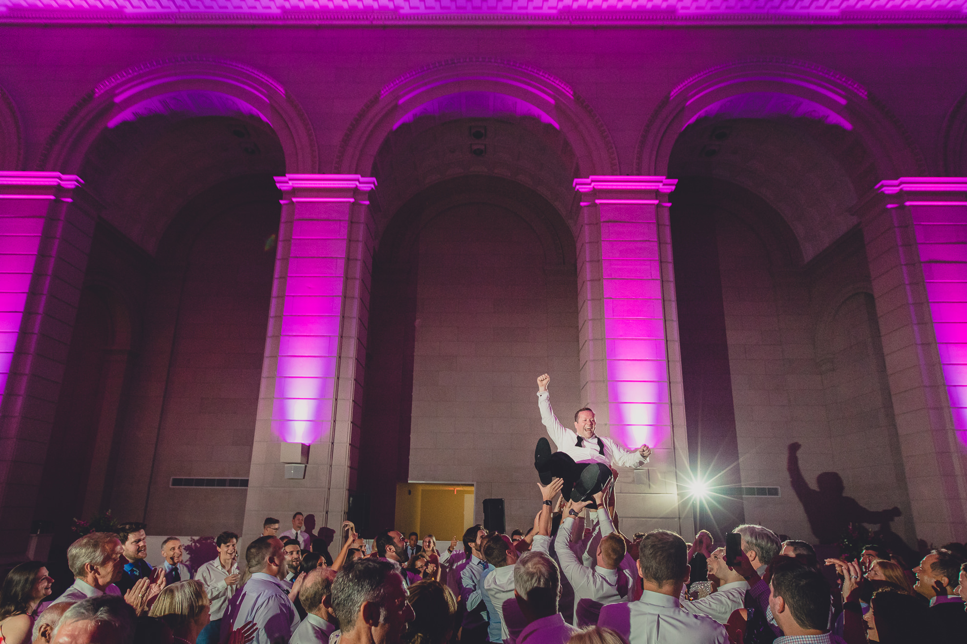 Guests dance in the Admiral Room Ballroom wedding reception venue in downtown Buffalo, NY