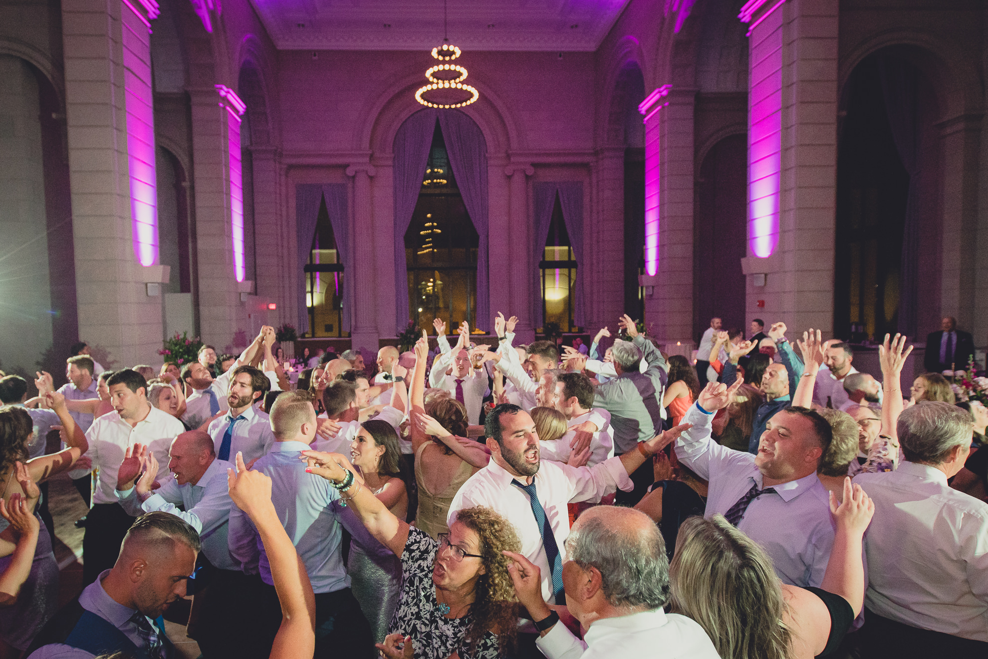 Guests dance in the Admiral Room Ballroom wedding reception venue in downtown Buffalo, NY