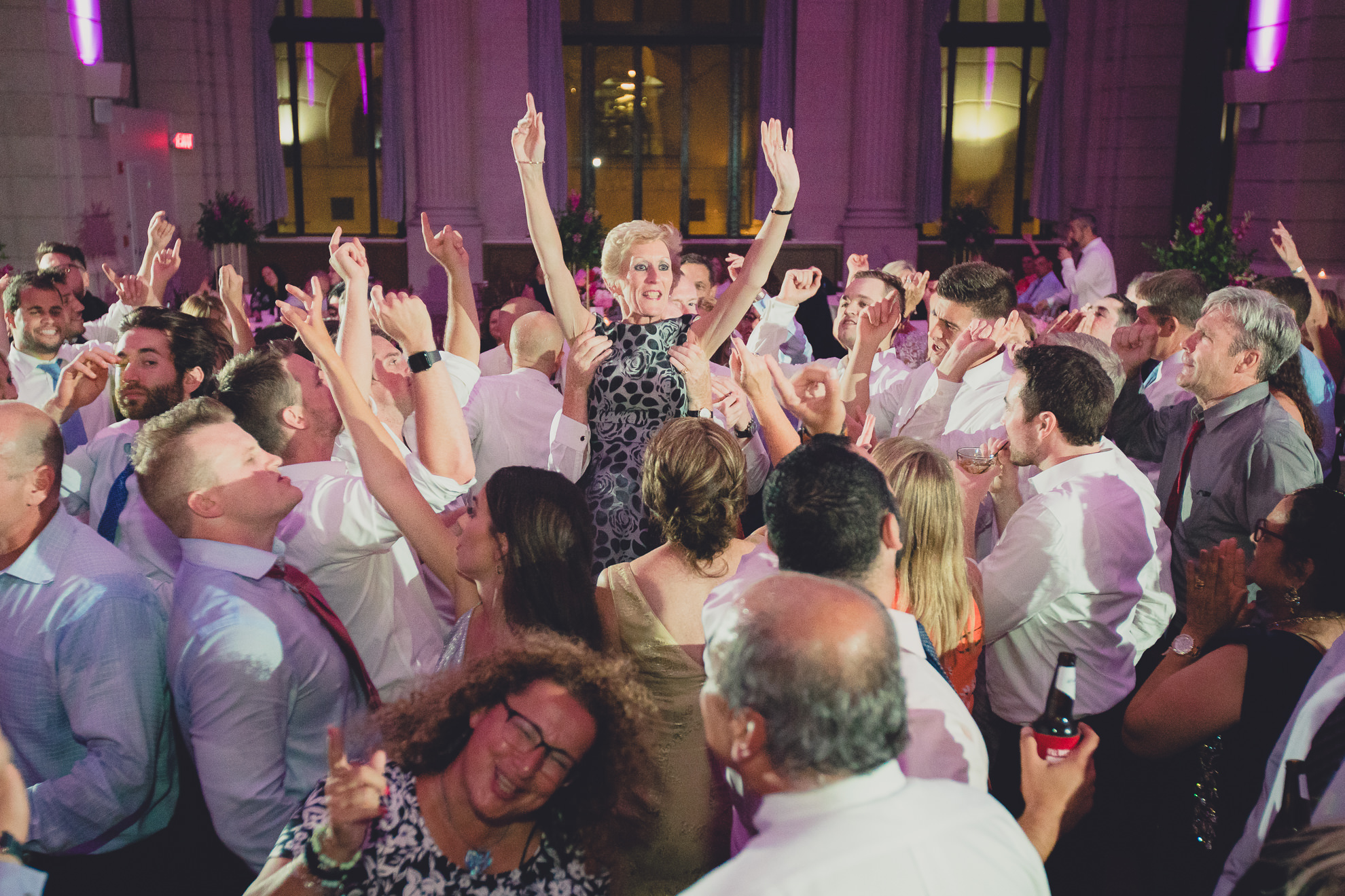 Guests dance in the Admiral Room Ballroom wedding reception venue in downtown Buffalo, NY